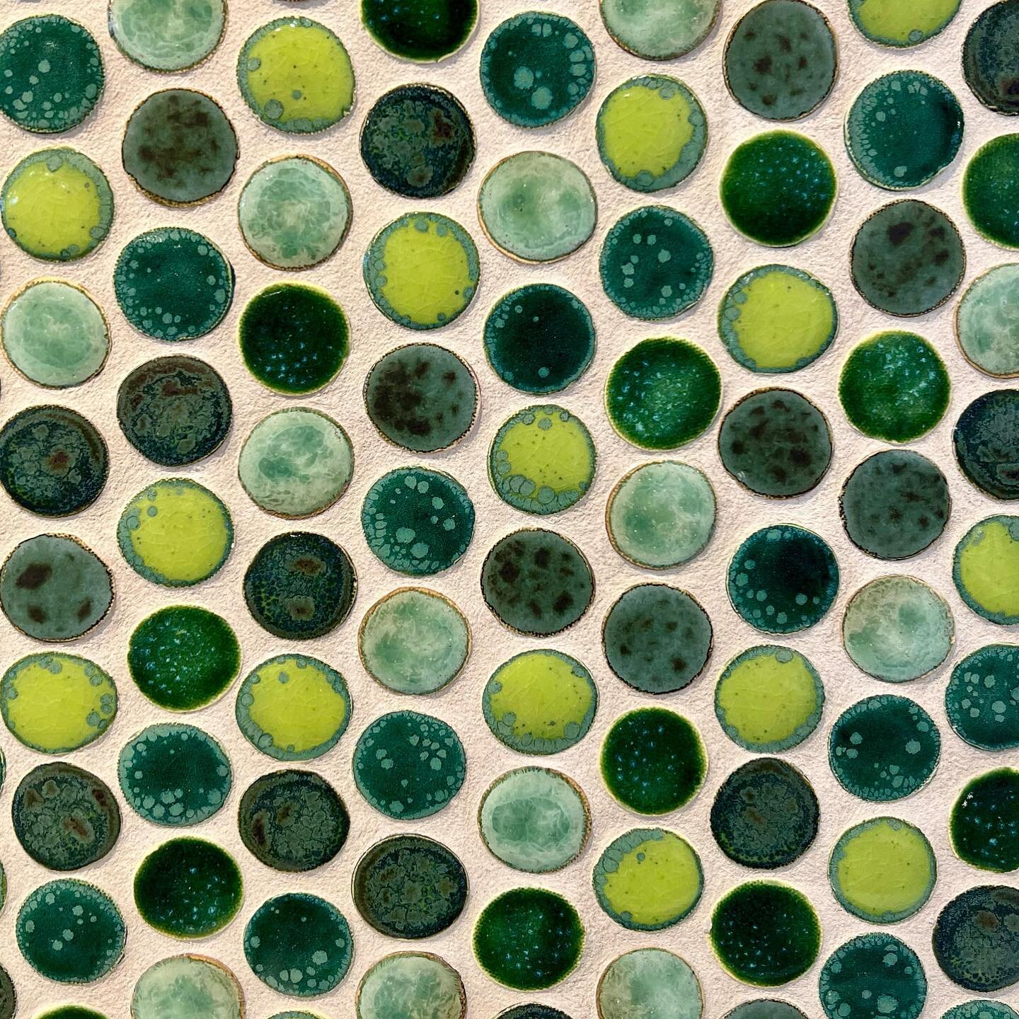 Penny tiles in a mix of custom green glazes for a new floor installation.  #pennytiles