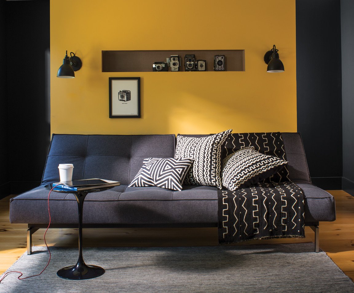 Living_room_with_yellow_accent_wall_gray_couch.jpg