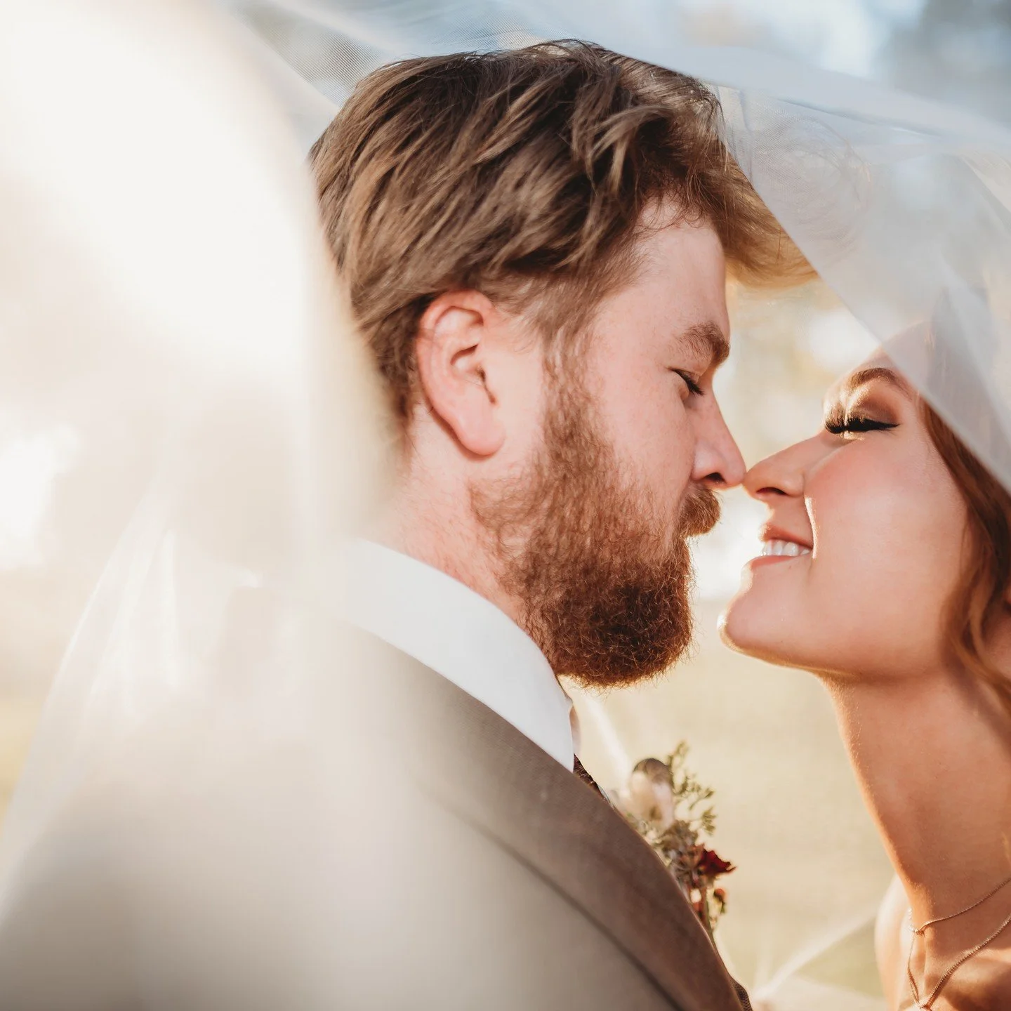 A bride and groom share a tender and private moment at their luxe wedding in Fort Wayne, IN, planned by bella and fern event planning.