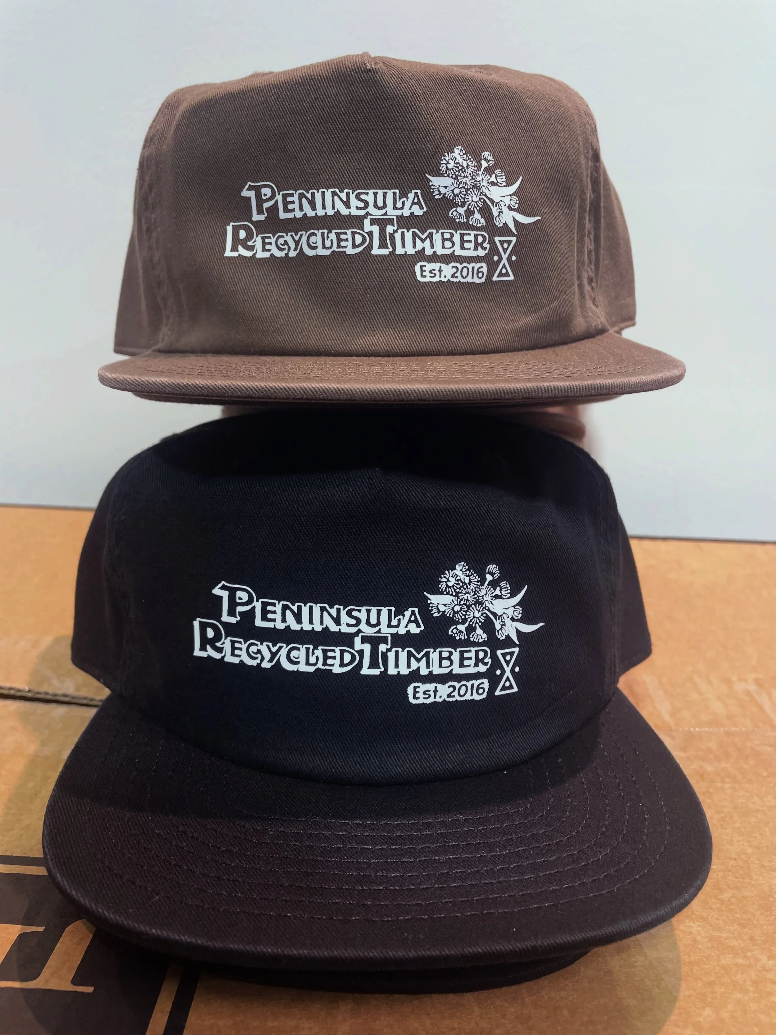 Screen printed caps for @peninsularecycledtimber. This is a great option for finer designs that can&rsquo;t be embroidered. #ascolouraustralia #caps #headwear #screenprinted