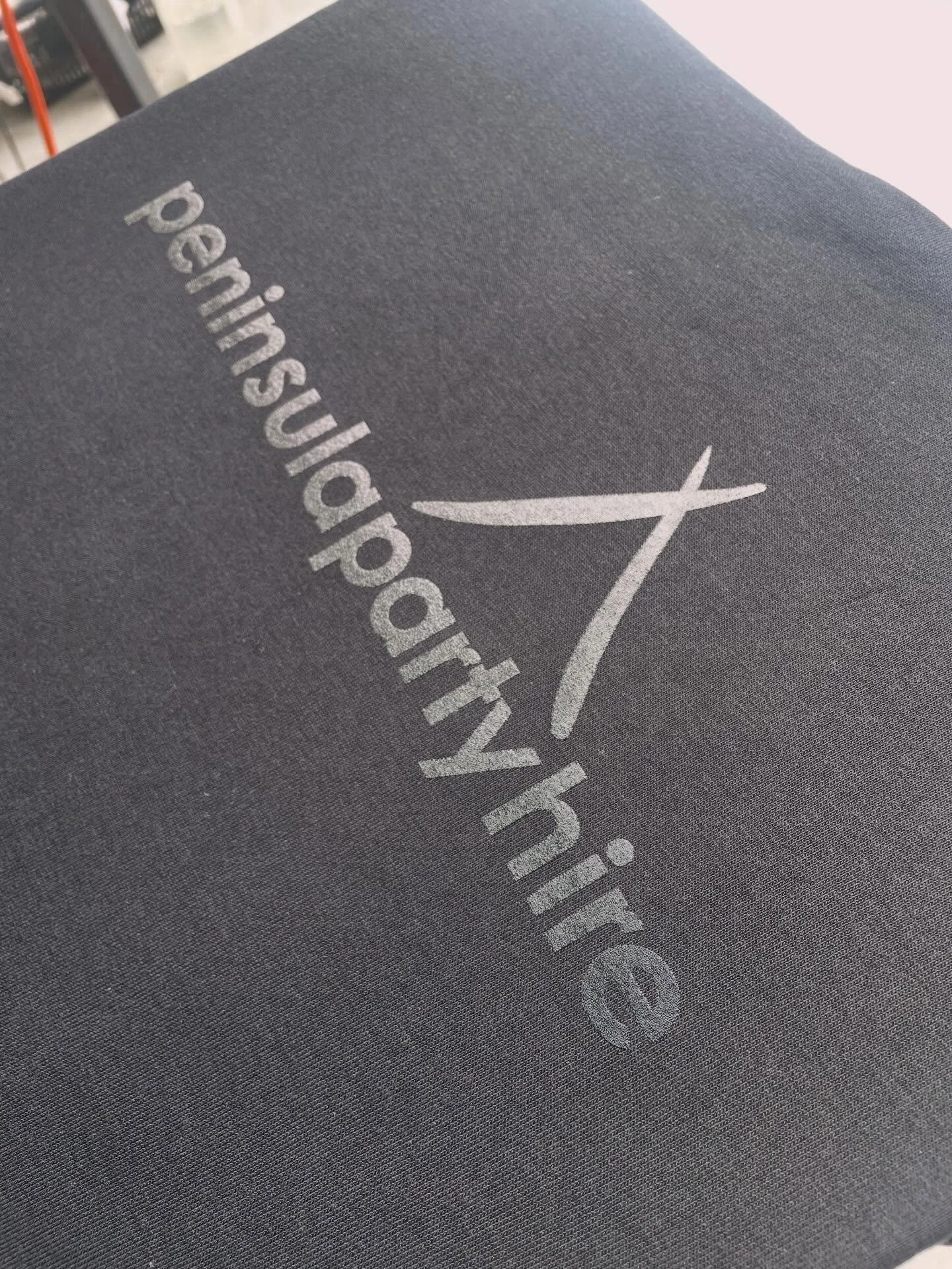 A little black on black action. Gives a wet look, we like it! #peninsulapartyhire #jbswear #screenprinter