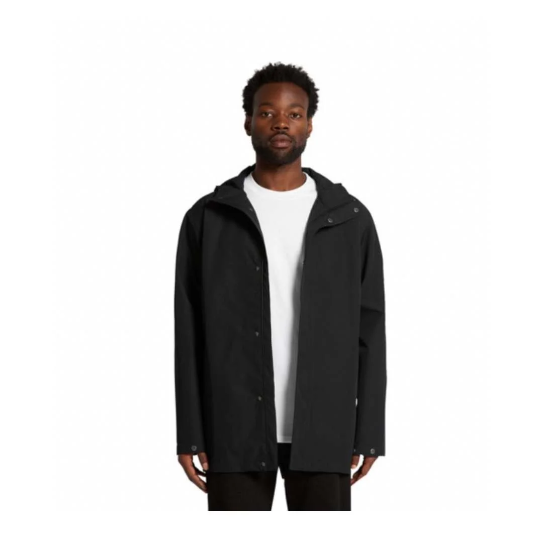 Man wearing a black rain jacket over a white T-shirt against a plain white background.