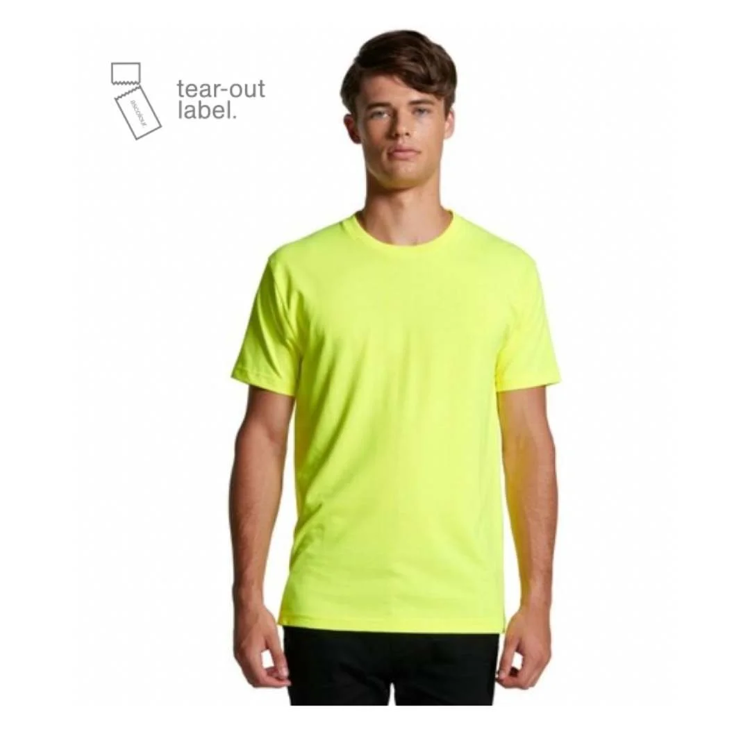 A young man wearing a bright yellow t-shirt with a tear-out label in the top left corner.