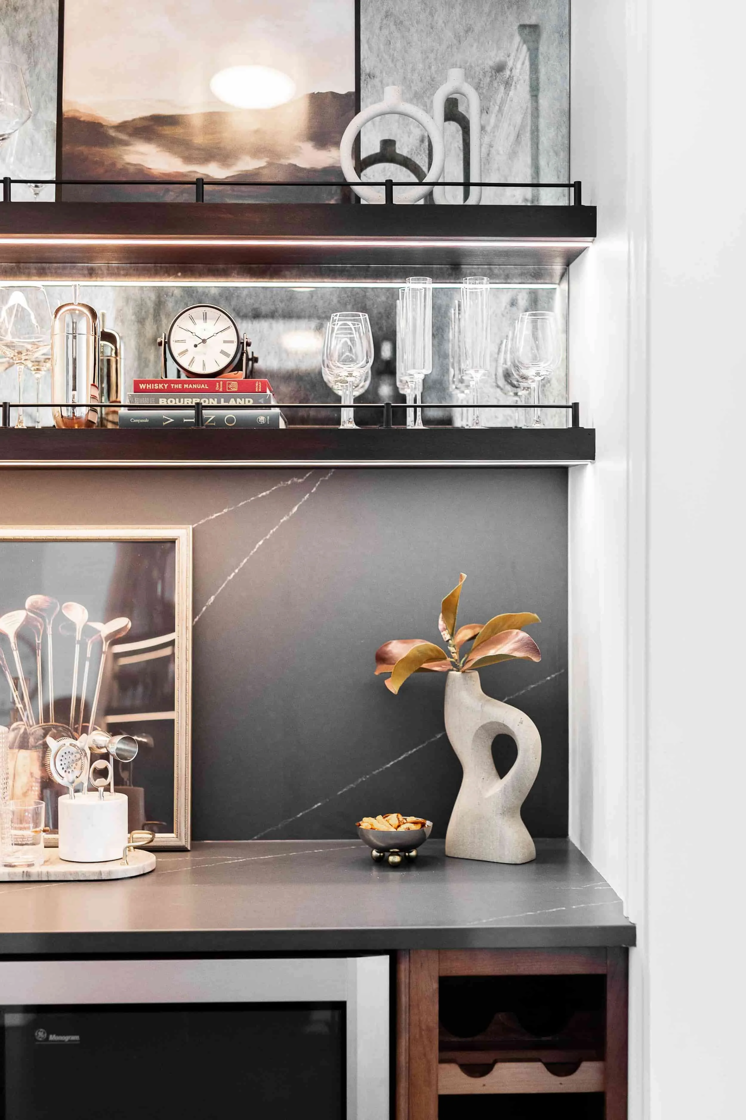 Antique mirror with black rails and custom led shelves