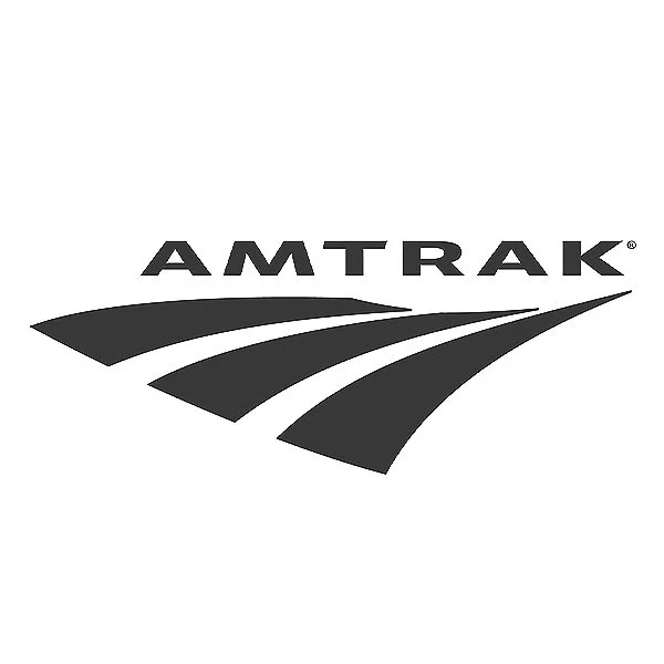 Amtrak logo with stylized train tracks beneath the company name in black and white.