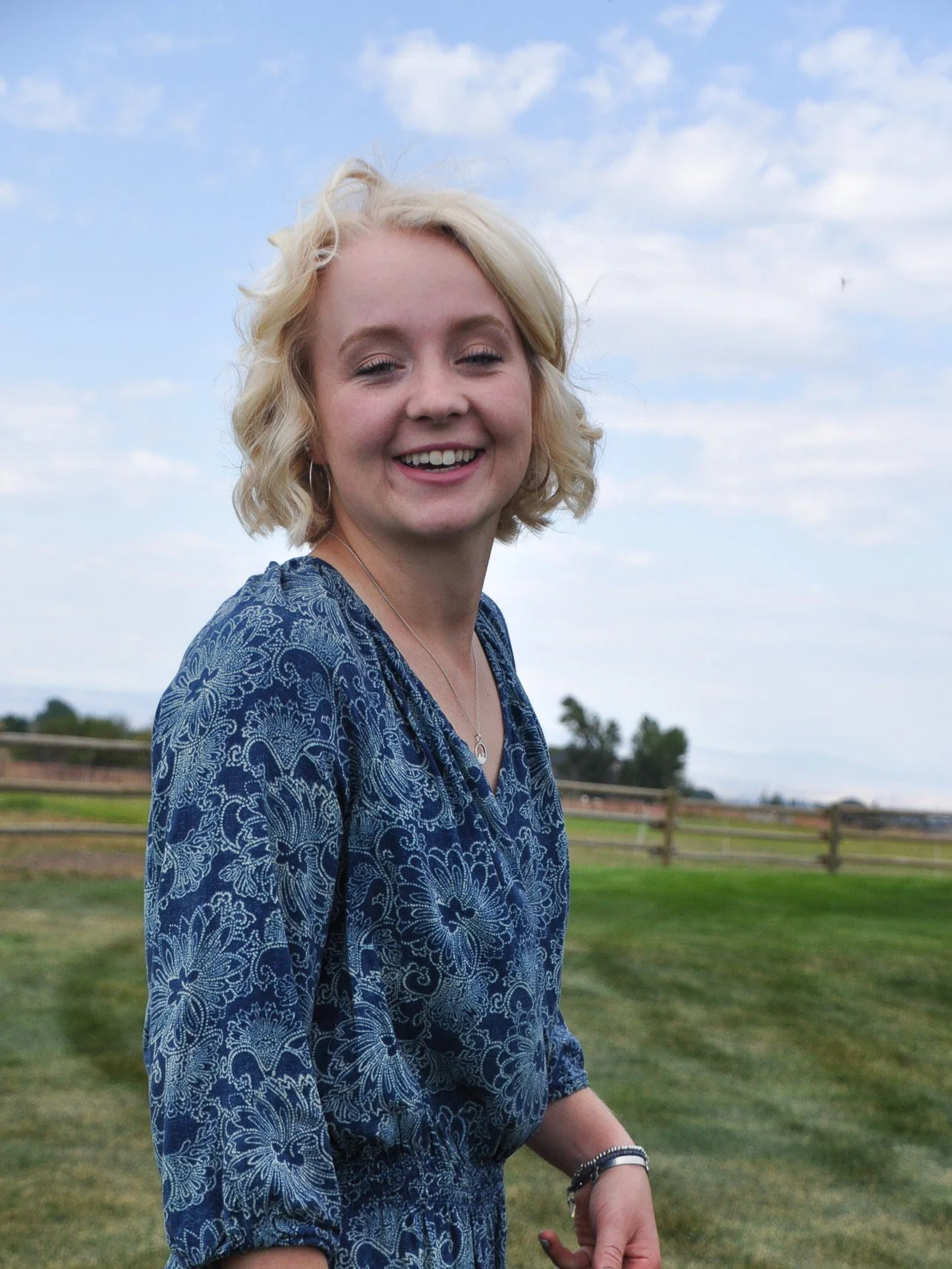 woman with blonde hair in a field