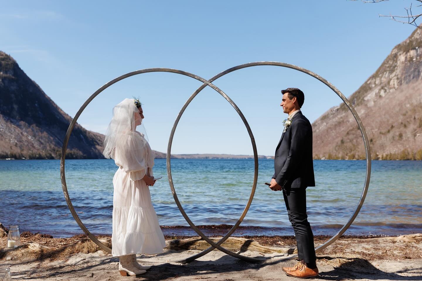 One week ago I had the honor of photographing AND officiating this stunning eclipse elopement on the shores of Lake Willoughby!  Ashley and Marc came up from Pennsylvania with their two dogs, 9 month old baby, their camper, and this amazing arbor tha