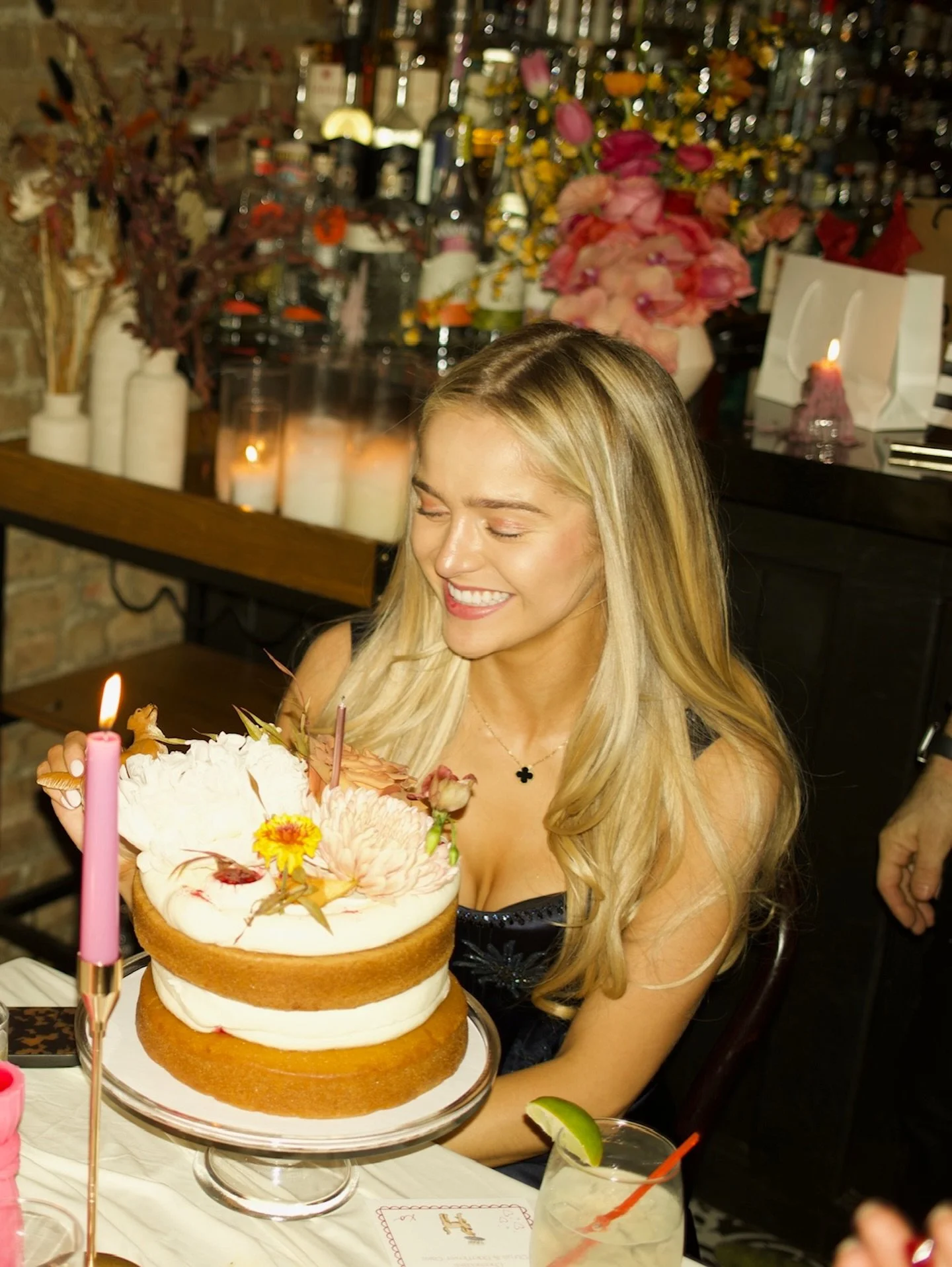 A New York City birthday dinner calls for rainbow taper candles and a cake from @fromlucienyc 🍎