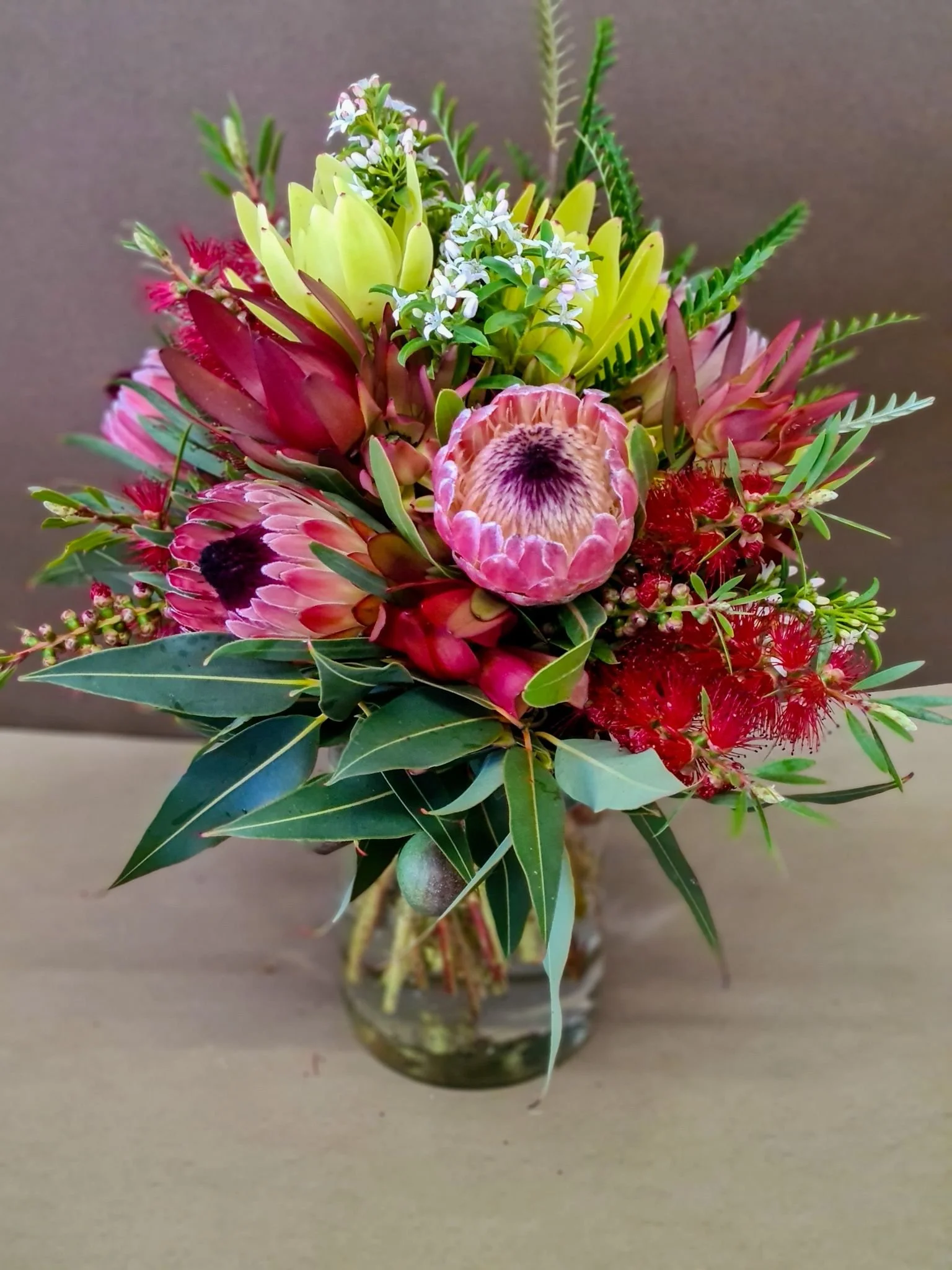 Vase- $80 small - A contemporary vase with an assortment of fresh flowers.