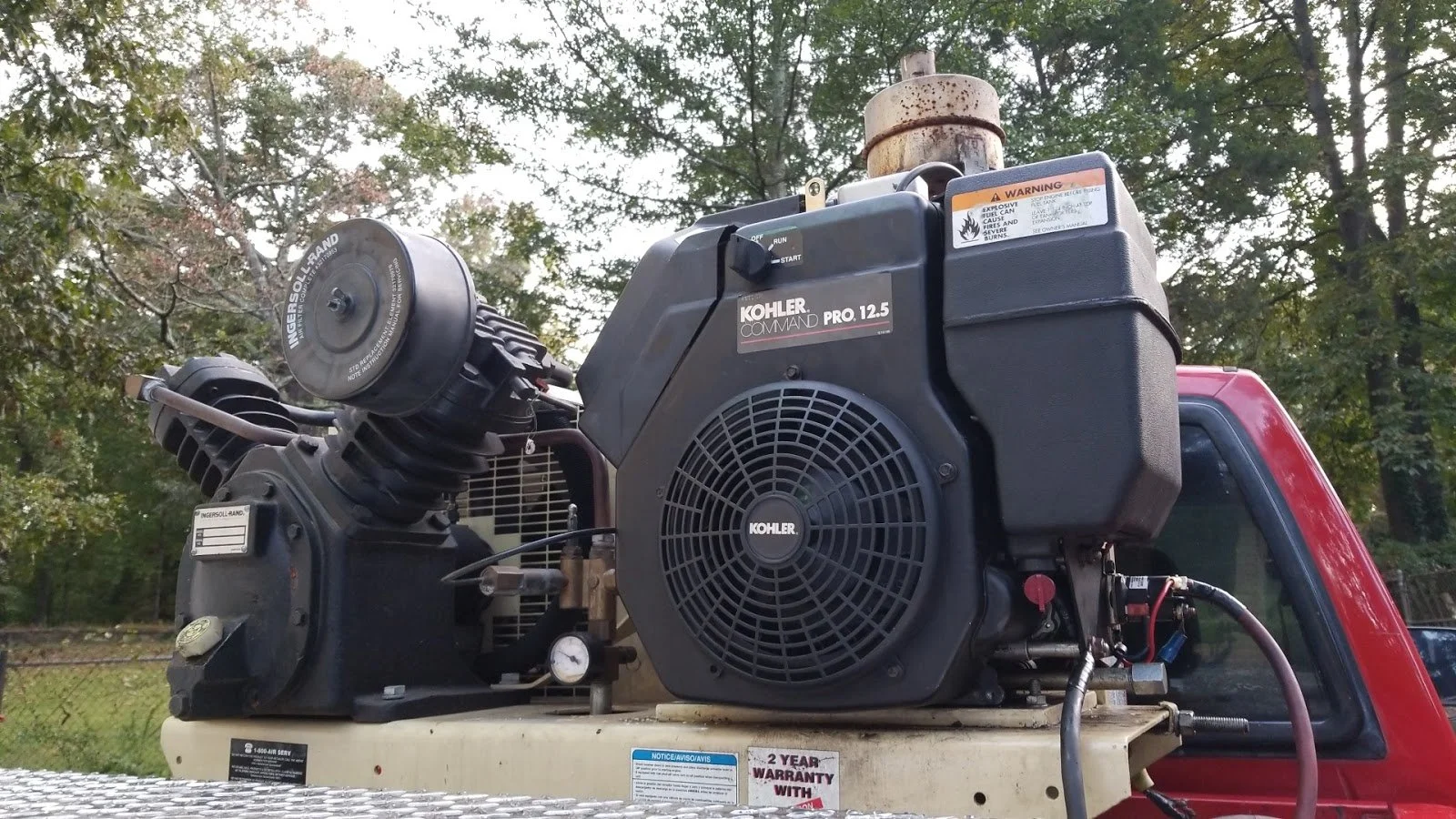 A gas-powered Kohler Command Pro 12.5 engine mounted on a tire service vehicle repaired by The Compressor Guy, LLC.