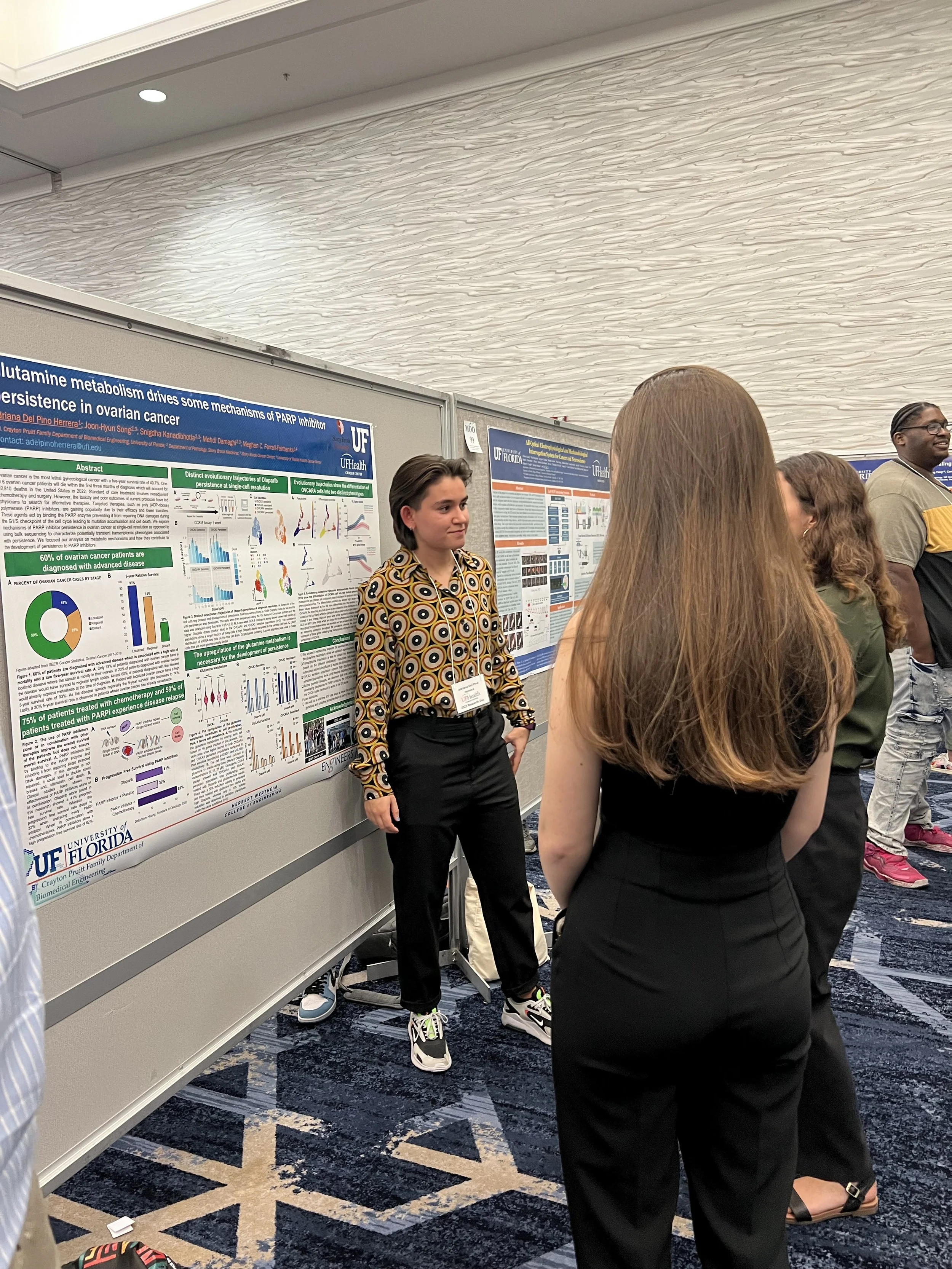 Adriana, Camara, Juan, and Syed present posters on their research at the UF Health Cancer Center Research Day