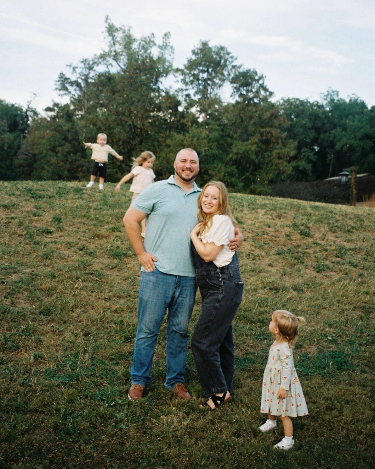 I really love when photos look + feel like real life. I think that&rsquo;s why this first frame is my favorite from this all film family session. Mom + Dad sneaking a quick moment of togetherness while their littles continue to find adventure all aro