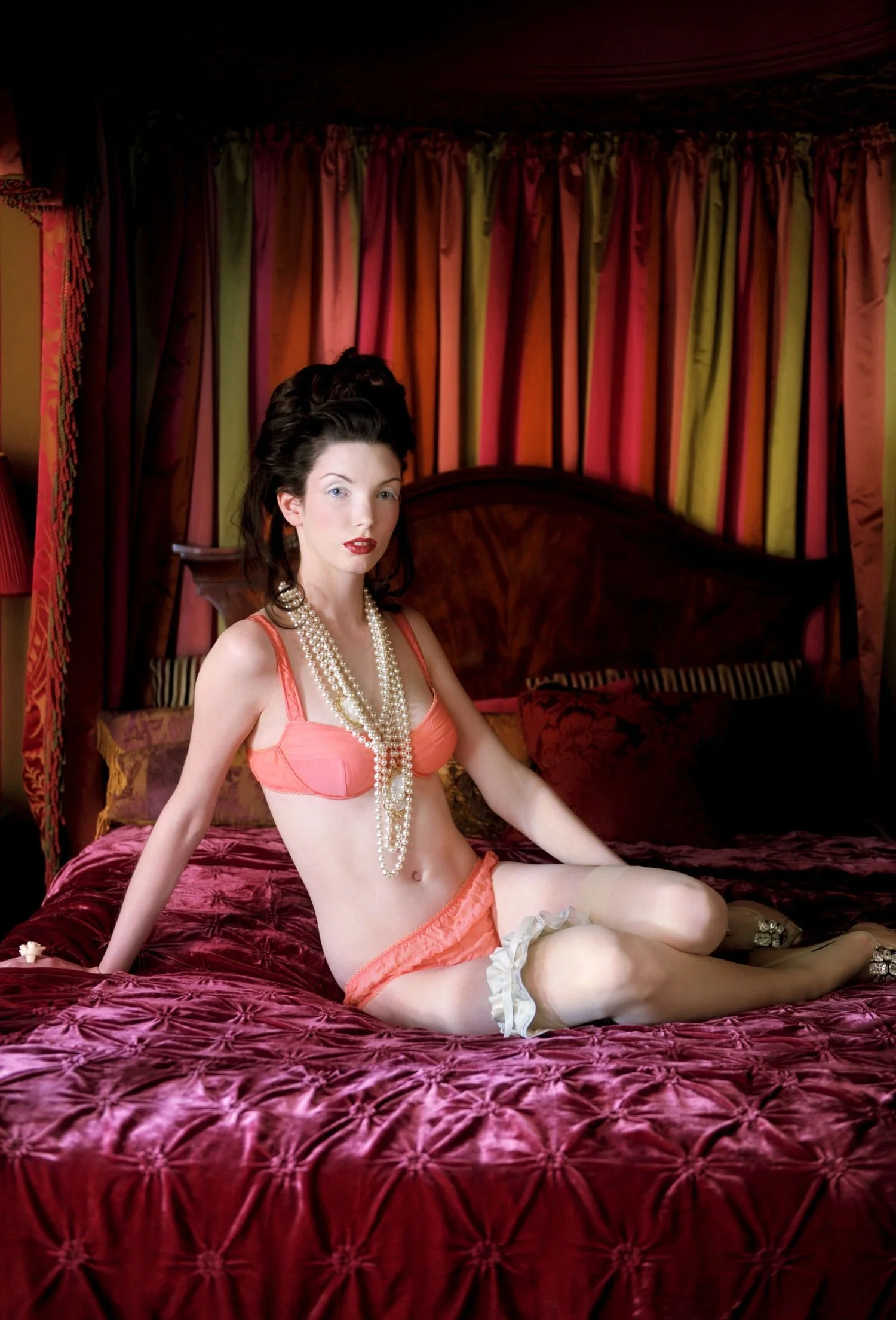 Model wears delicate lingerie with hair and make in the style of Marie-Antoinette