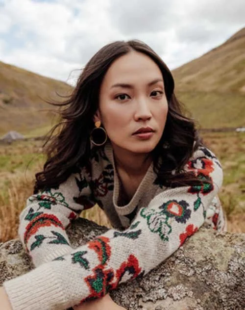 Promod 2018 collection - model wears jumper with big floral knit detail
