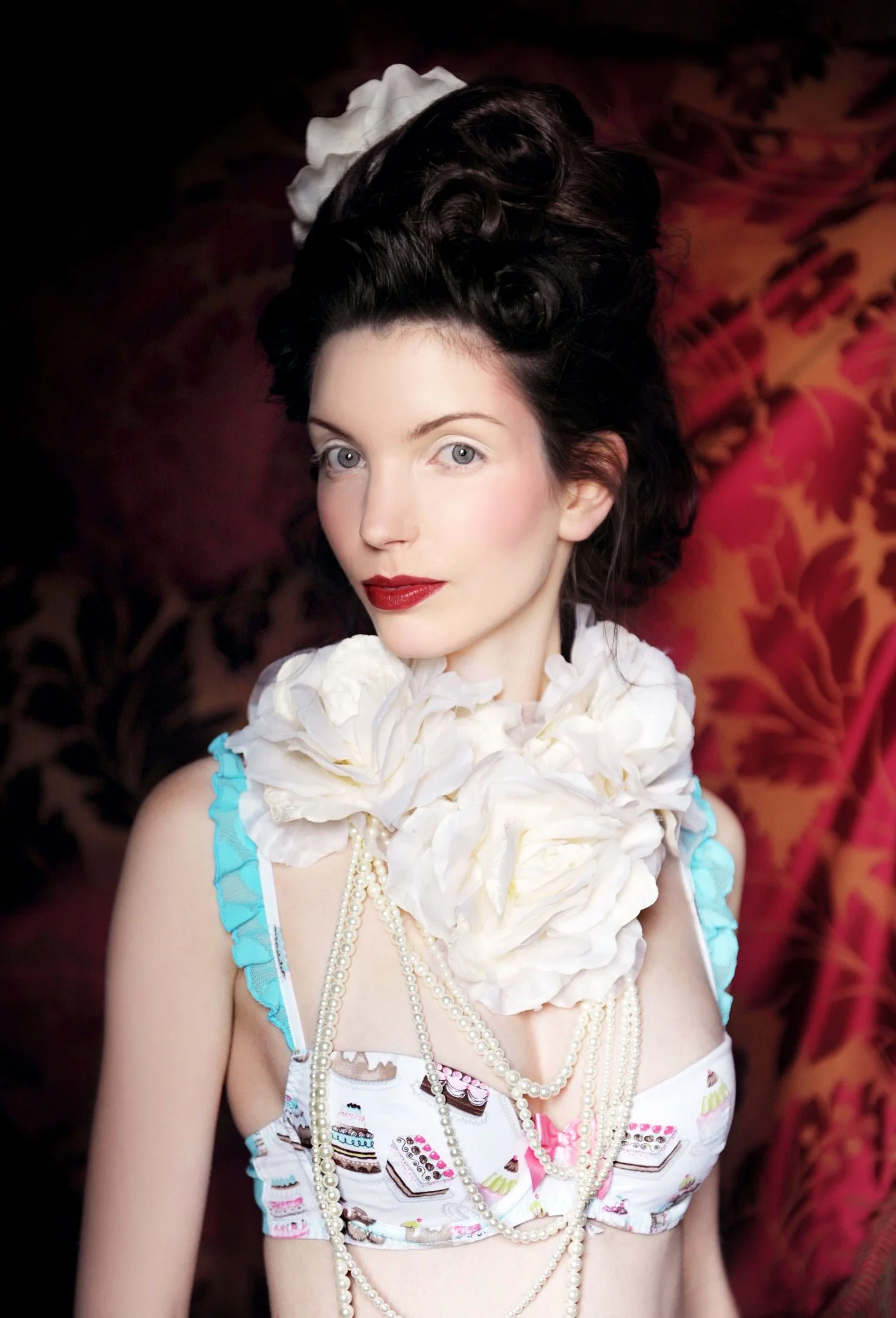 Model wears delicate lingerie with hair and make in the style of Marie-Antoinette