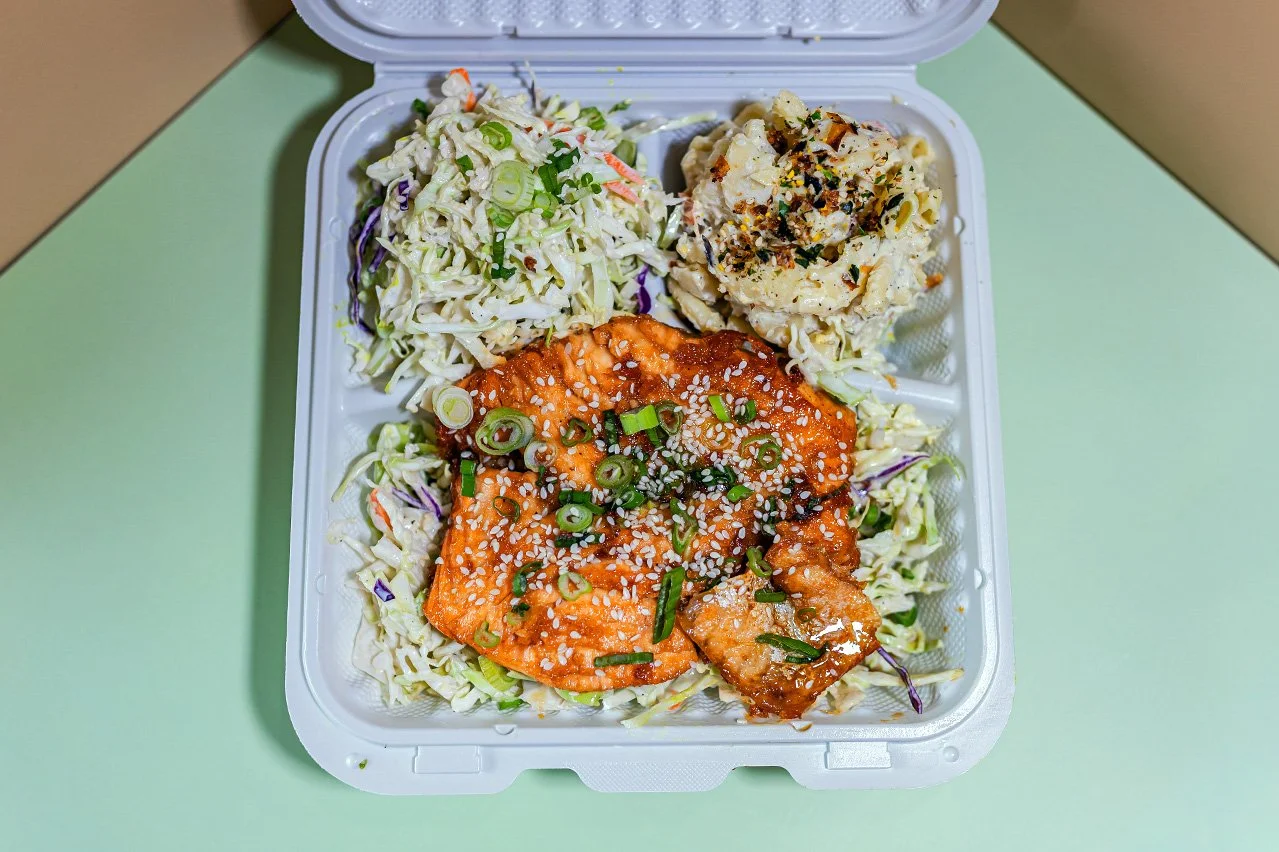 Soy Garlic Glazed Salmon special menu item with Salmon Filet, Soy Glaze, Garlic, Served with White Rice, Macaroni Salad, House Slaw.