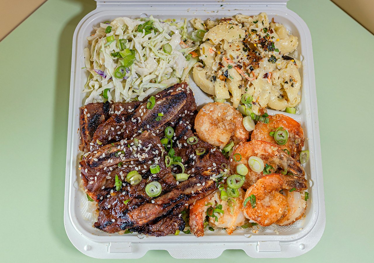 Garlic Butter Shrimp plus beef of any type combination plate over rice with side of house slaw and macaroni salad.
