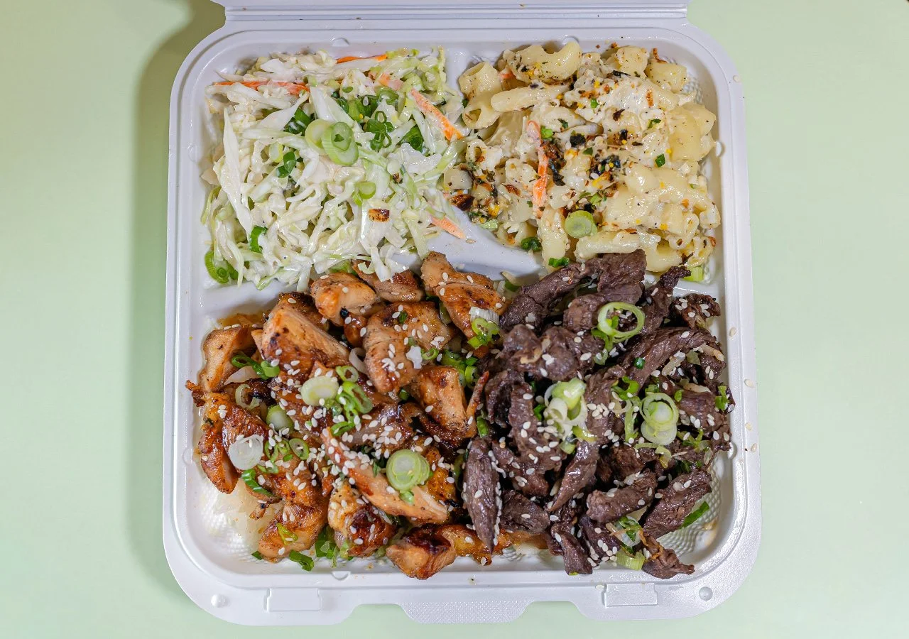 Chicken of any type plus beef of any type combination plate over rice with side of house slaw and macaroni salad.
