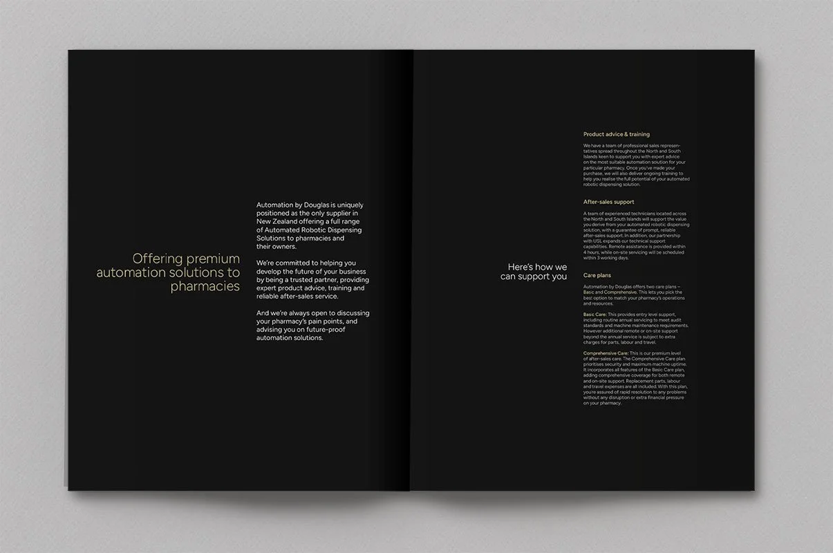 Kevin Schluter Design | Automation by Douglas | Service Design | Open black brochure with white text on a light gray background, featuring sections on pharmacy automation solutions and support services.