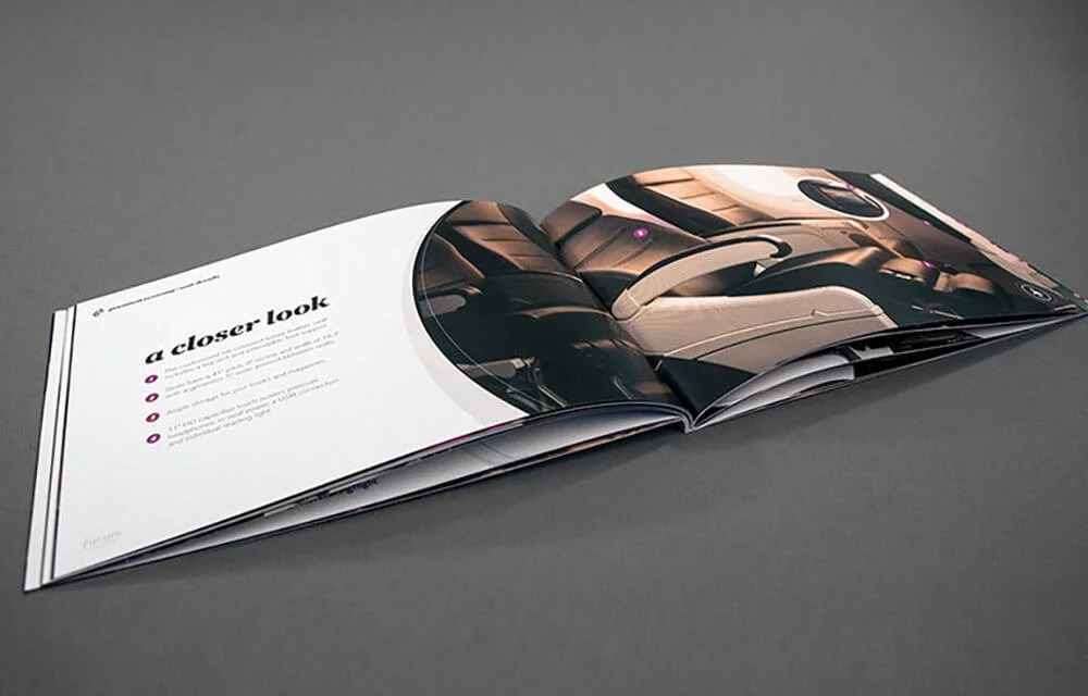 Open magazine displaying a page with the heading "a closer look" and an image of a car interior on the right page.
