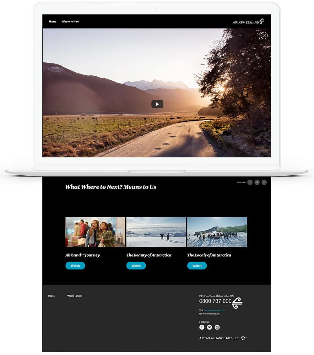 A laptop screen showing a travel website for Air New Zealand. The top shows a video of a scenic road with mountains and sunset. The bottom section displays three travel options: Airband Journey, The Beauty of Antarctica, and The Locals of Antarctica, each with a "Watch" button.