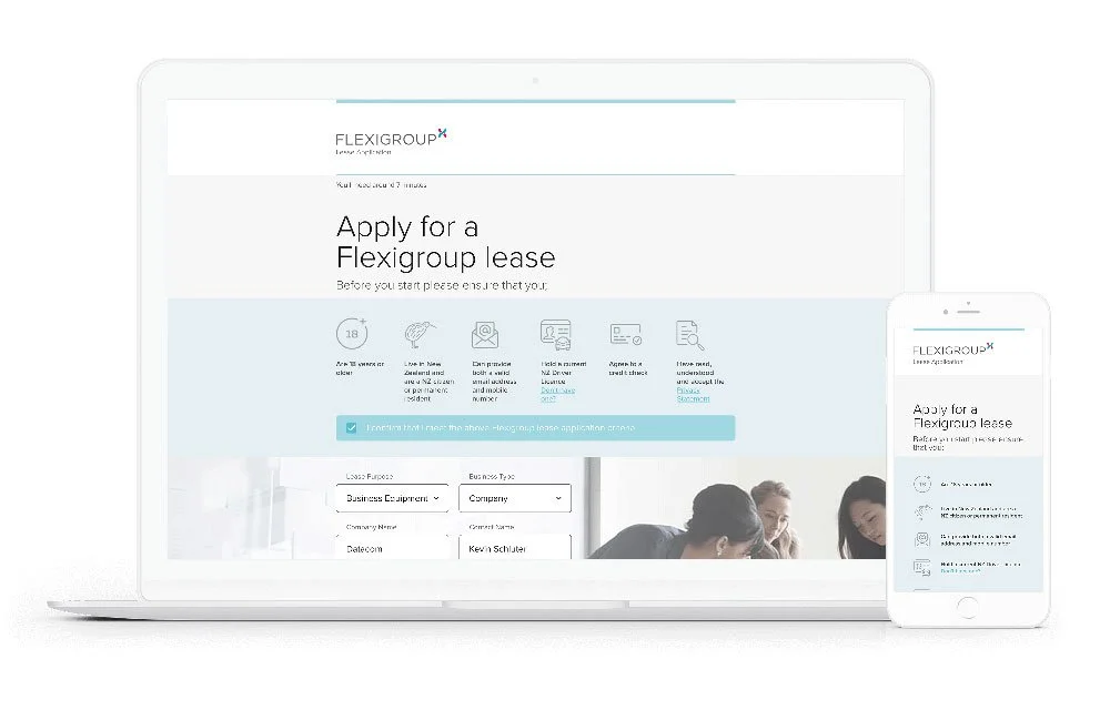 Laptop and smartphone displaying Flexigroup lease application form with fields for purpose, business type, company name, and date, and an image of people working together.