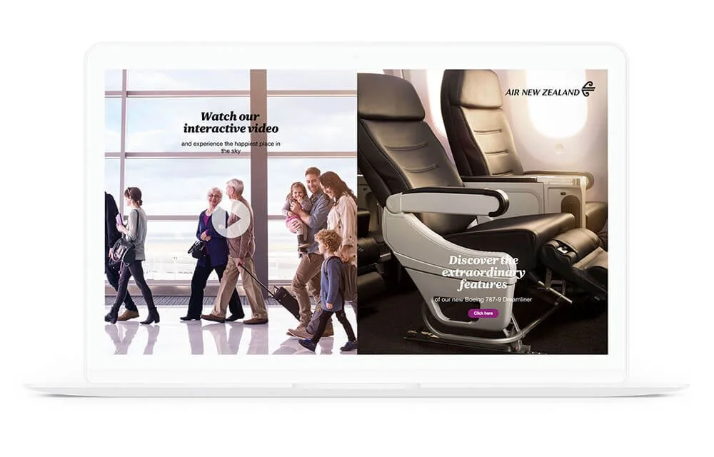 A laptop screen displays an advertisement for Air New Zealand with an image of passengers at an airport and an airplane seat, promoting the airline's features and a video.