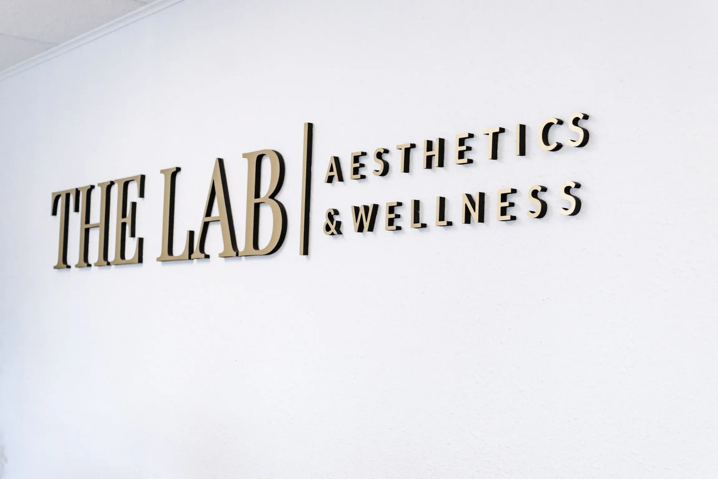 An inside sign of The LAB Aesthetics and Wellness