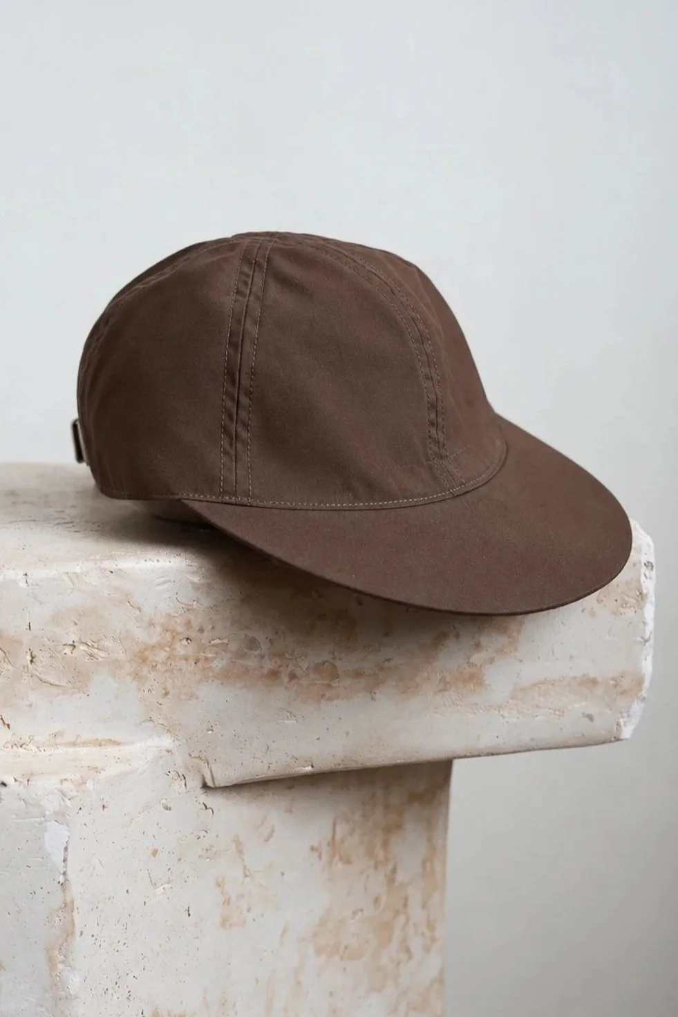 Brown+Cap+on+Weathered+Stone+Pedestal.jpg