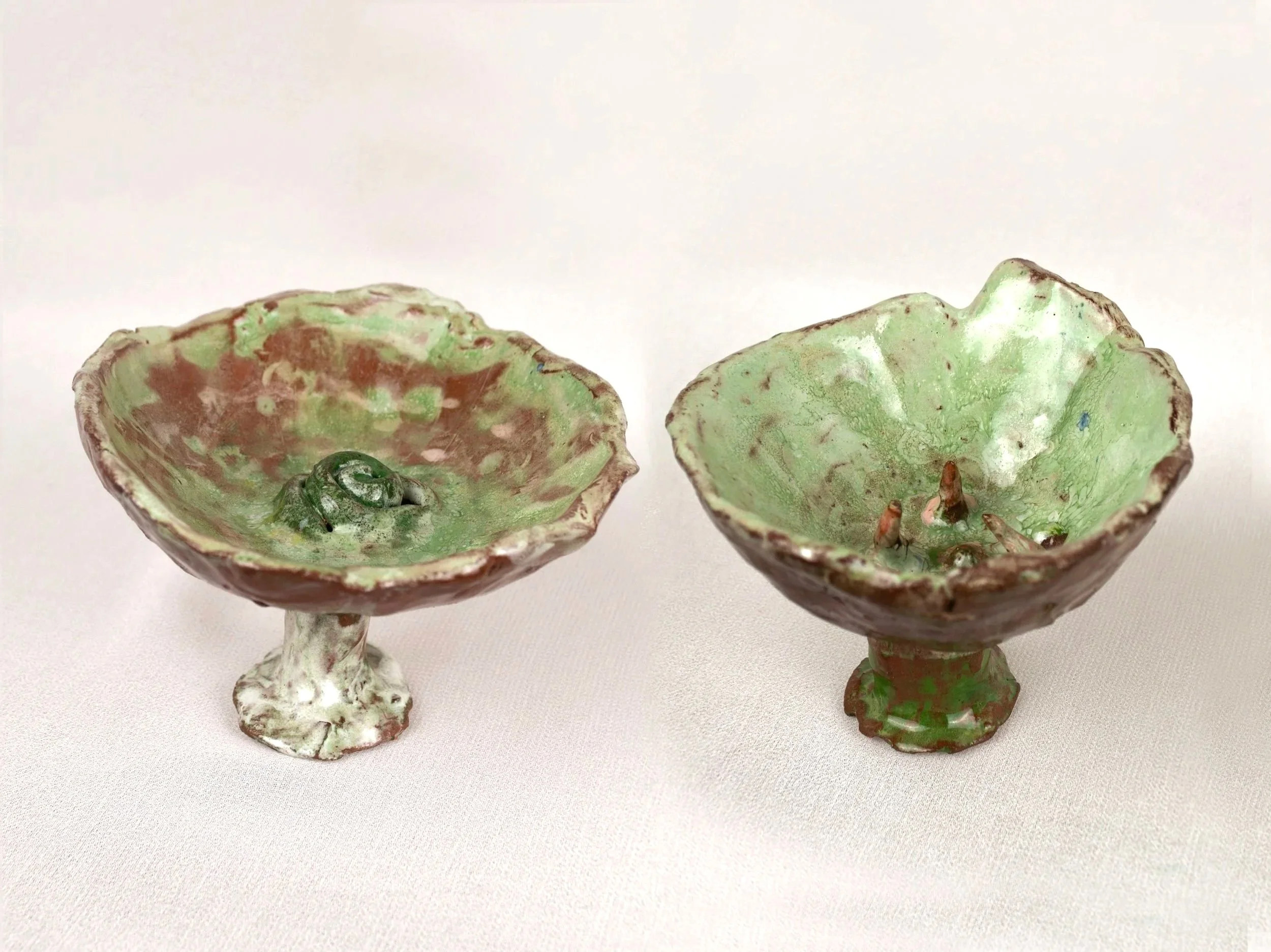 Bodies in Bloom, 2025. Glazed earthenware — 6.5 x 8.5 x 10 cm, 6 x 8.5 x 9 cm