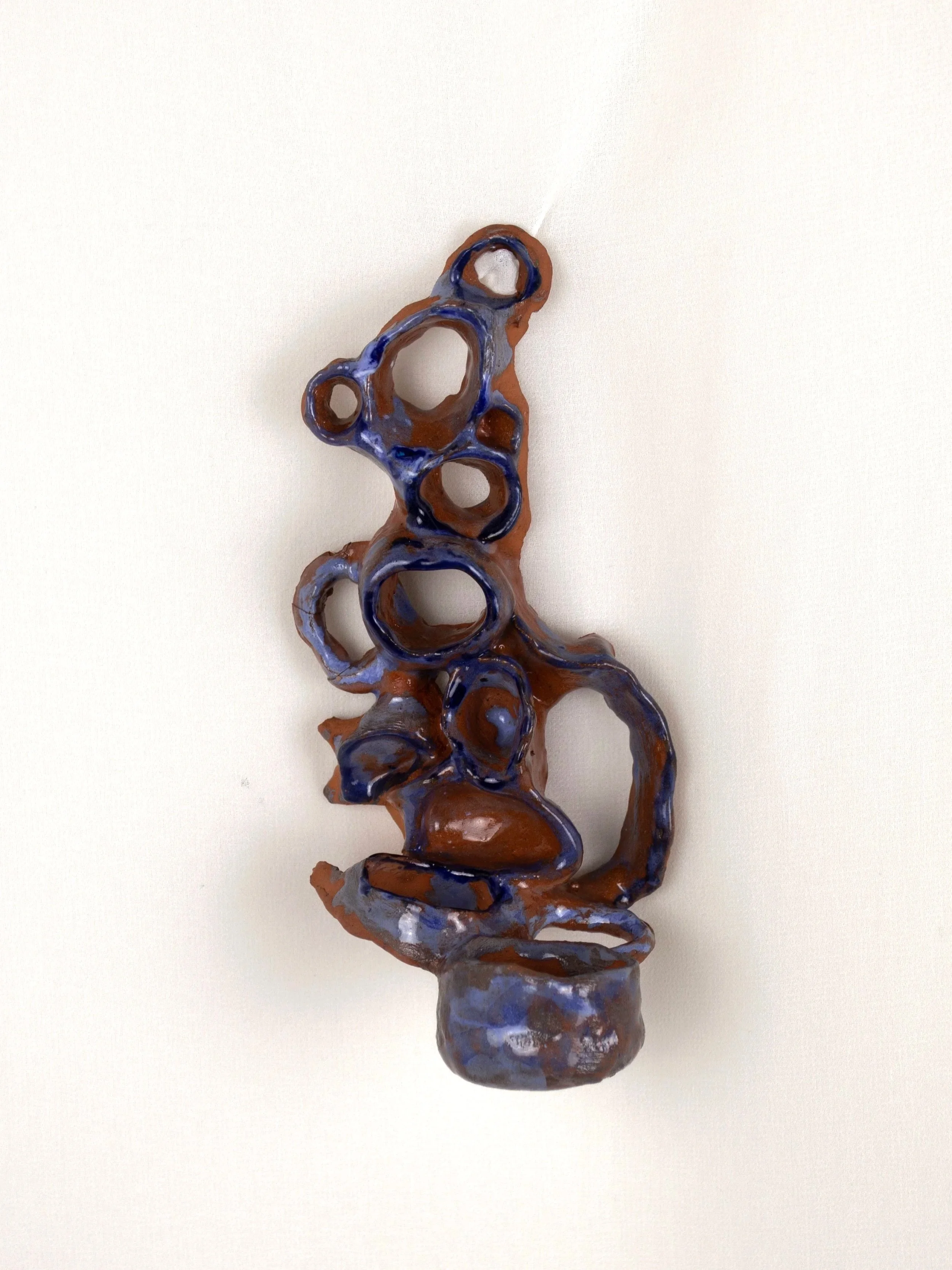Coralline Hanging Candle Holder, 2024. Glazed earthenware — 6.5 x 16 x 7 cm