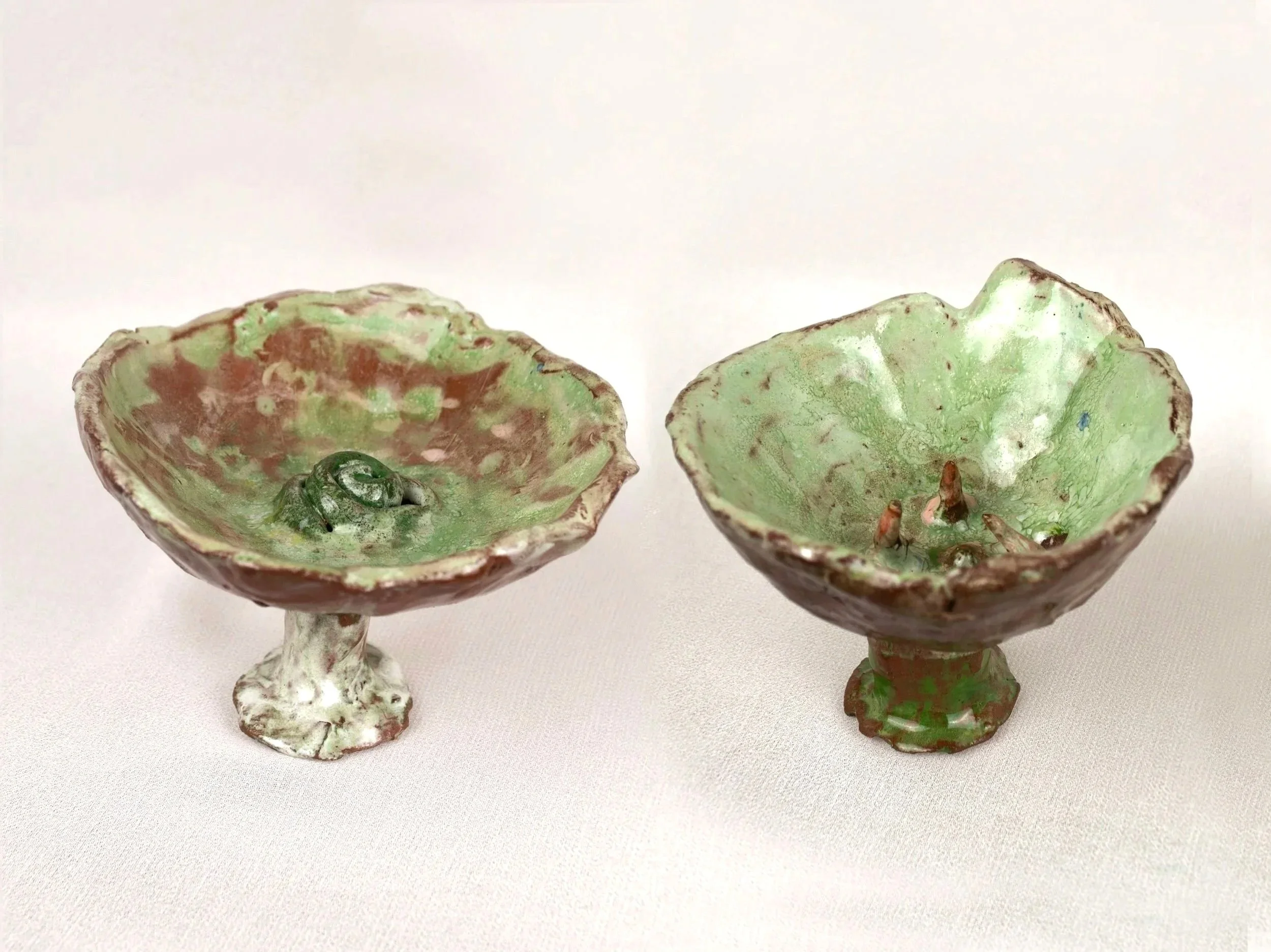 Bodies in Bloom, 2025. Glazed earthenware — 6.5 x 8.5 x 10 cm, 6 x 8.5 x 9 cm