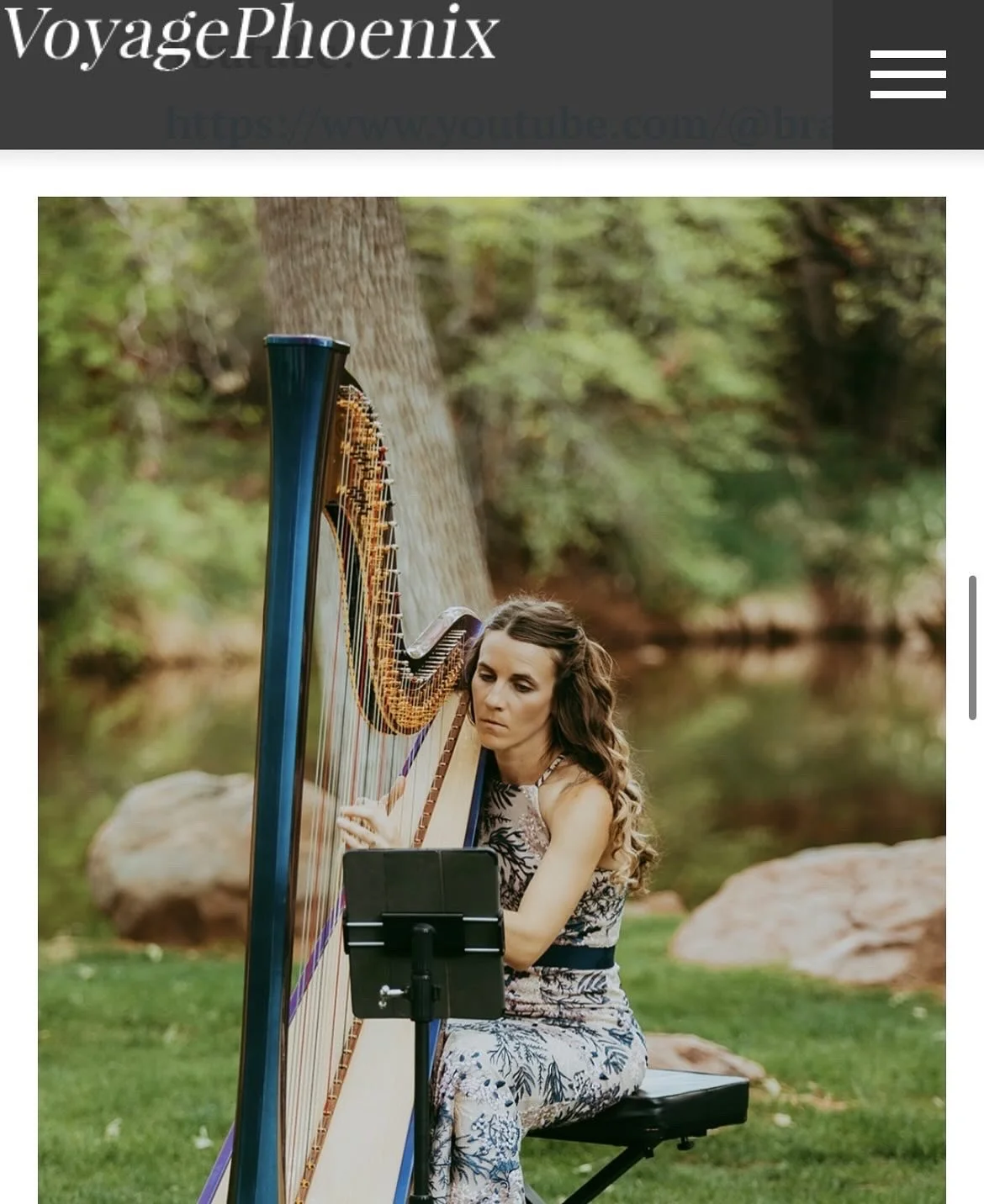 A woman playing a large harp outdoors during sunset in Sedona, Arizona. Sedona wedding Harpist. 