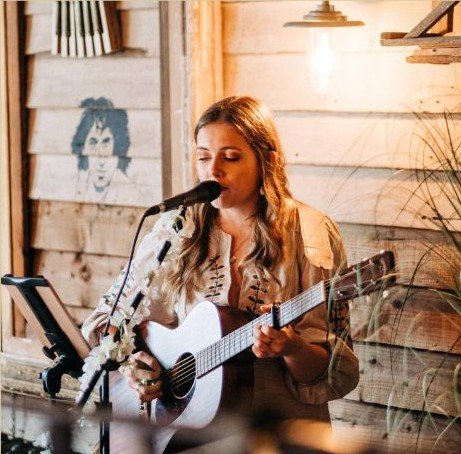 Live music preformed by Ezmay Grace in our Secret Garden