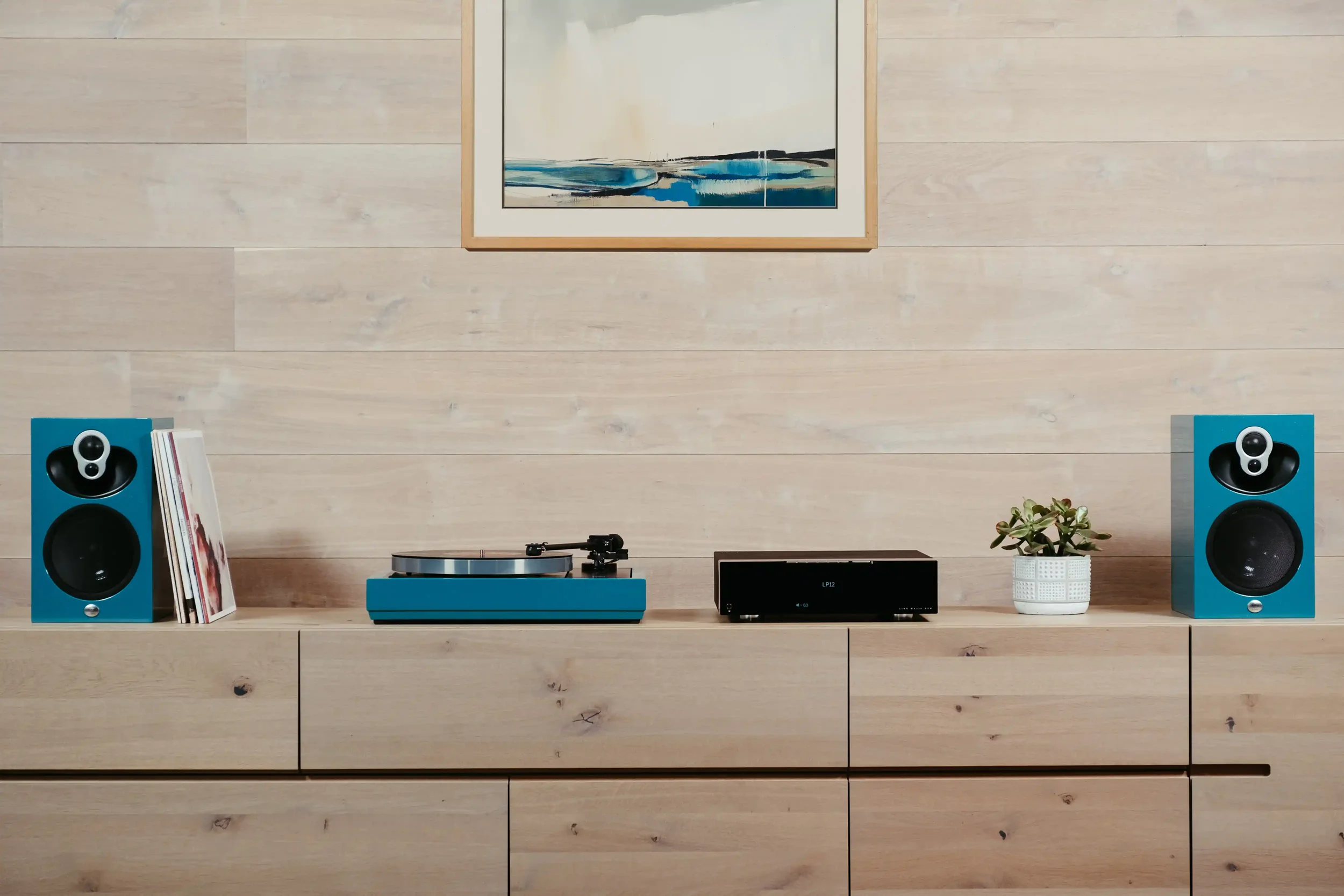A teal custom coloured Linn Klimax Music System in a modern luxury living space.