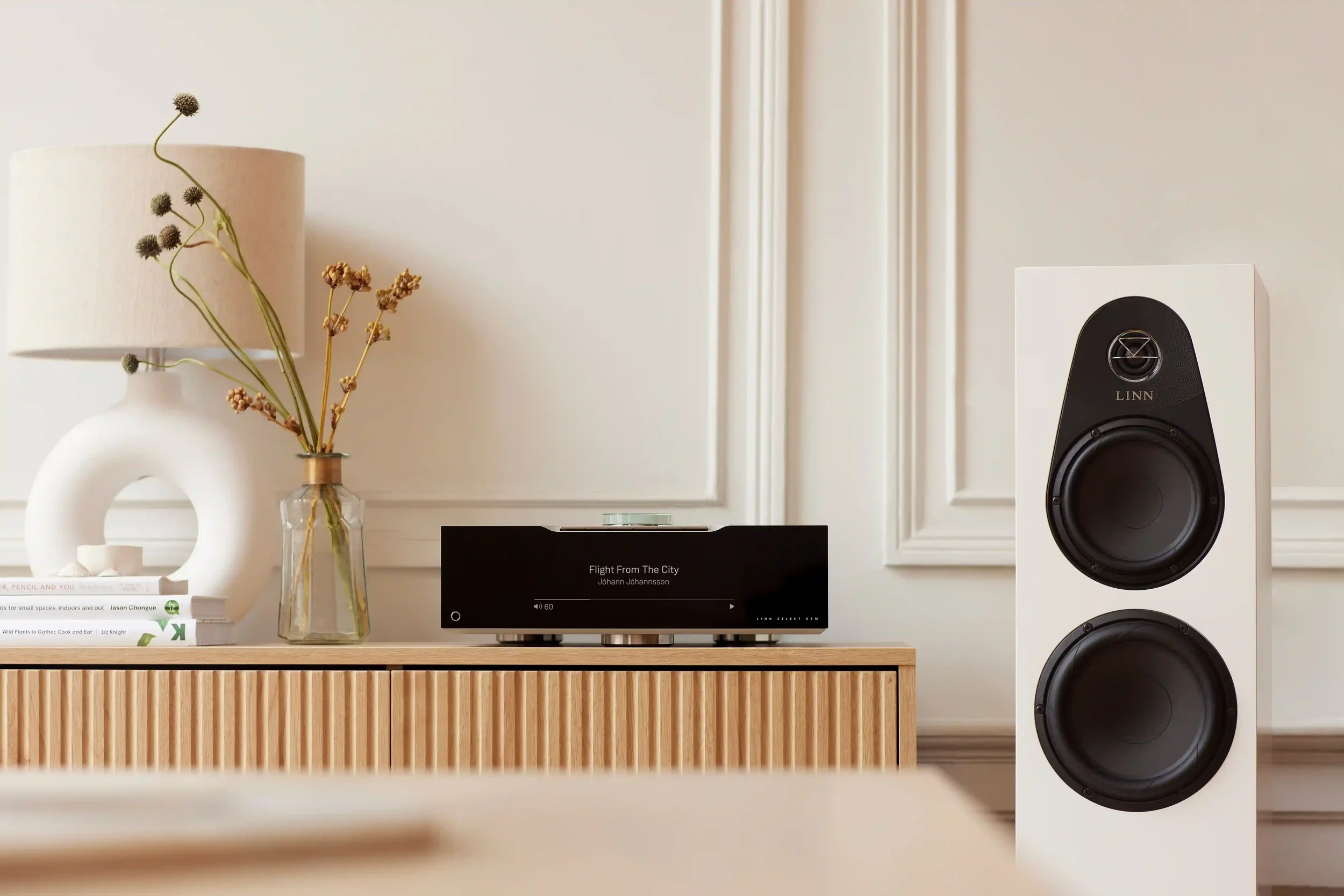 A Linn Selekt Music System in a contemporary modern home setting with a Selekt DSM displaying the song 'Flight From The City' by Johann Johannsson.