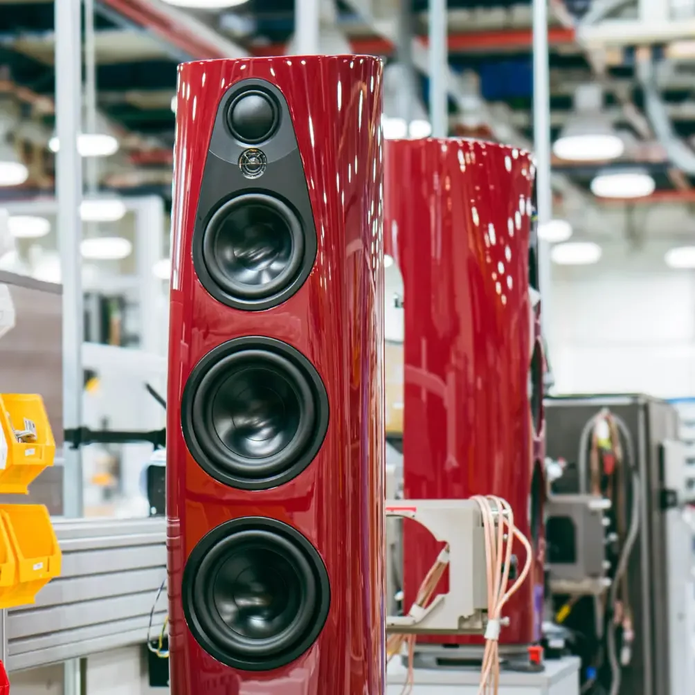 A red 360 floor-standing speaker with multiple drivers in the Linn Factory, Glasgow, Scotland.