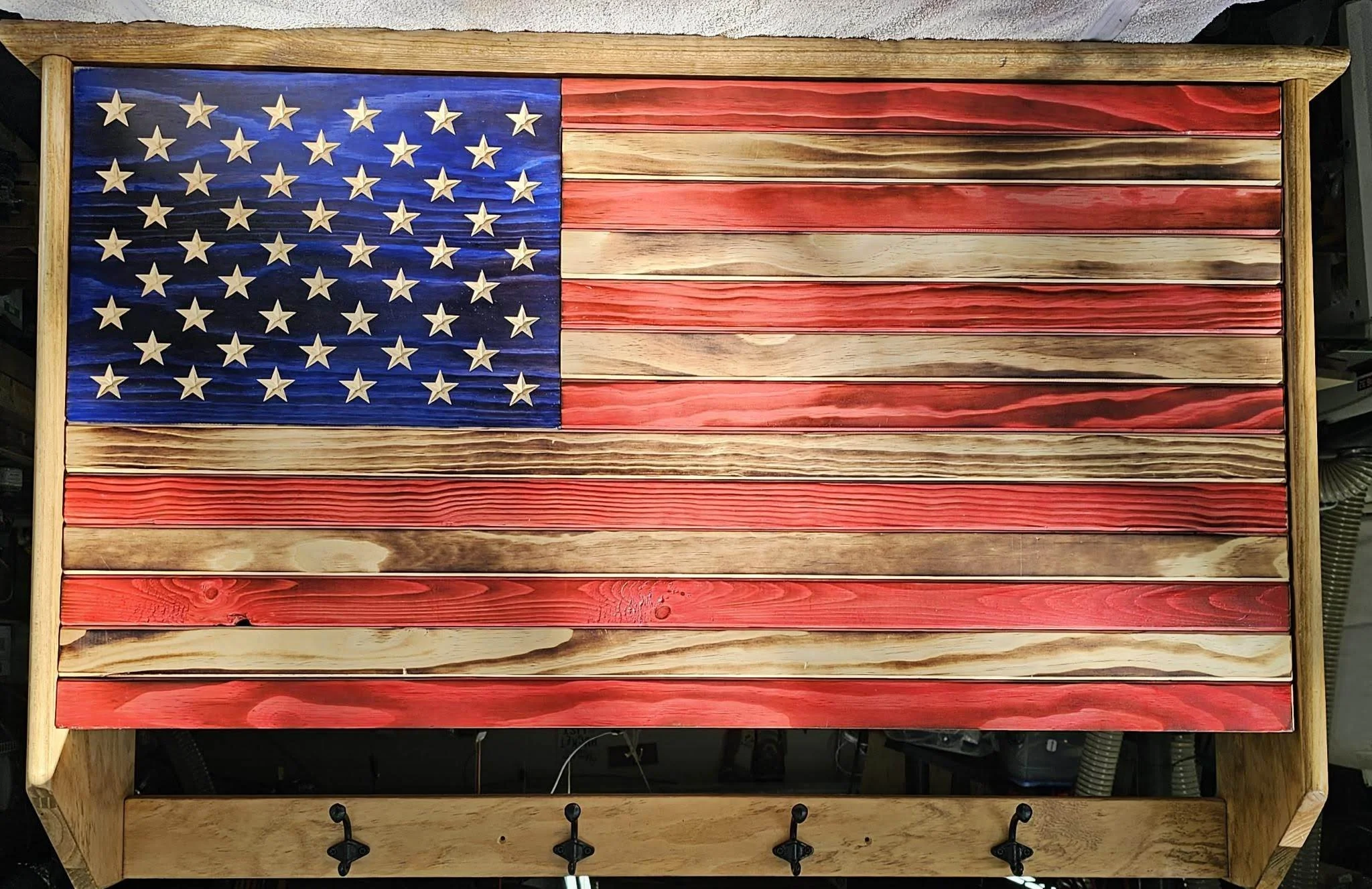 Wooden American flag with coat hooks