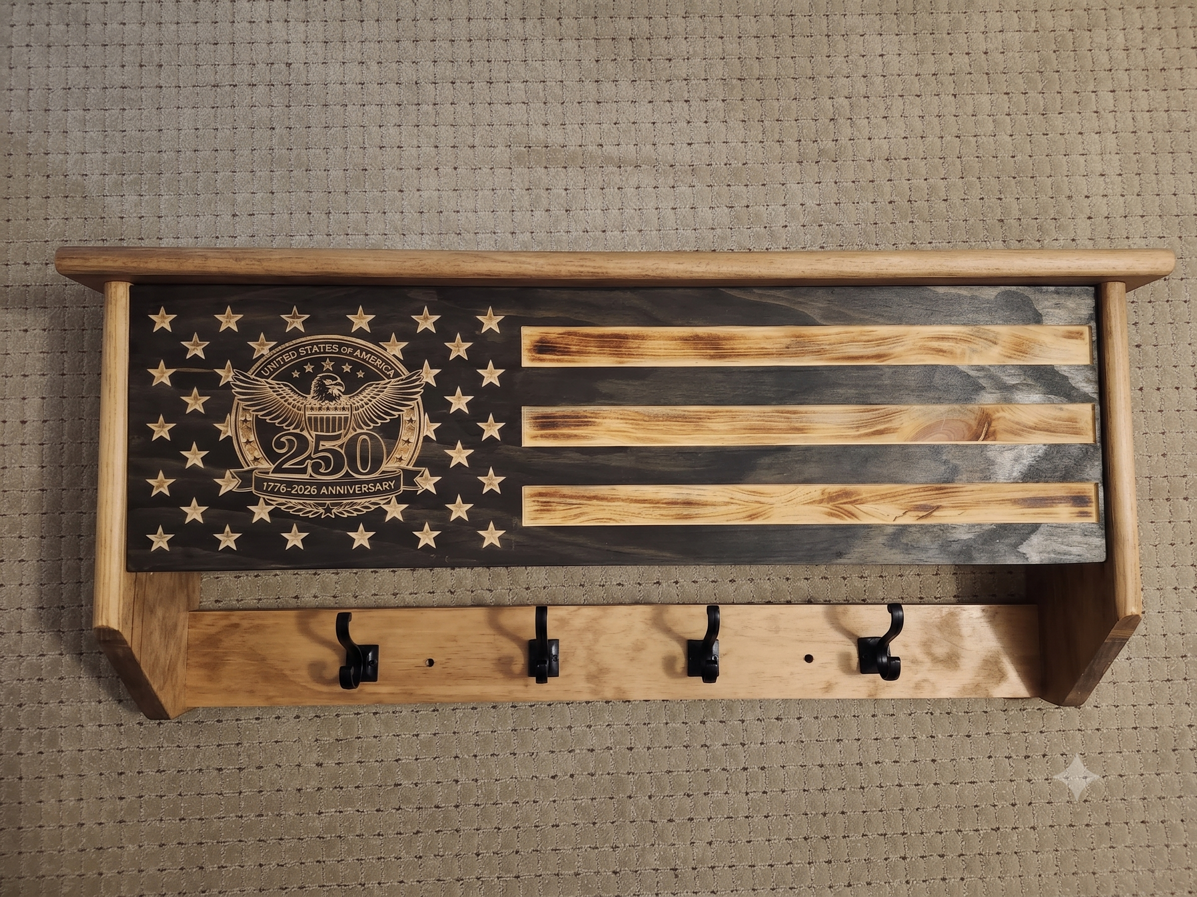 250th Anniversary concealment coat rack with carved 1776–2026 American flag design