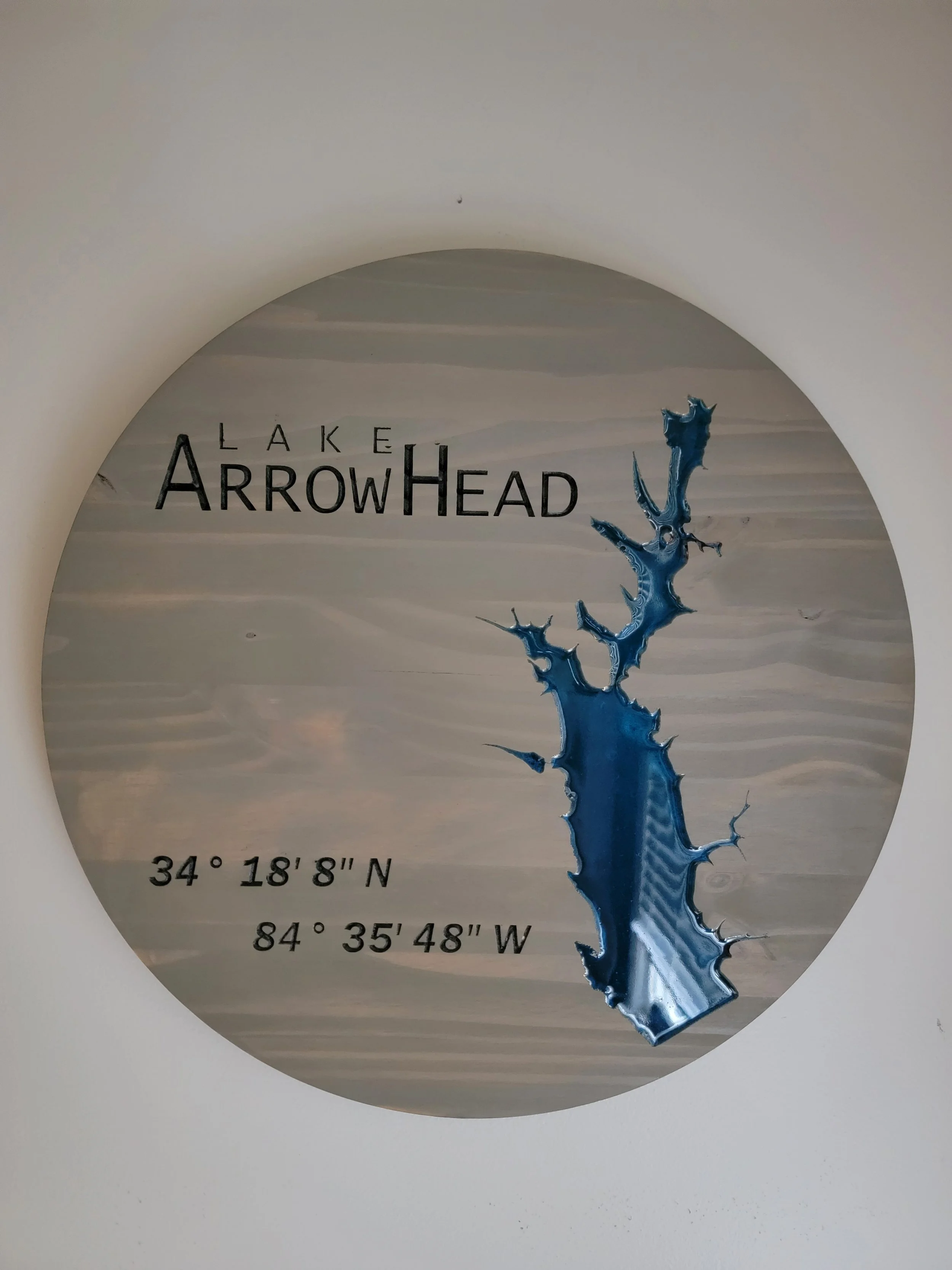 Handcrafted Lake Arrowhead Georgia wooden relief map with Sea Green epoxy lake, Weathered White finish, and latitude and longitude coordinates.