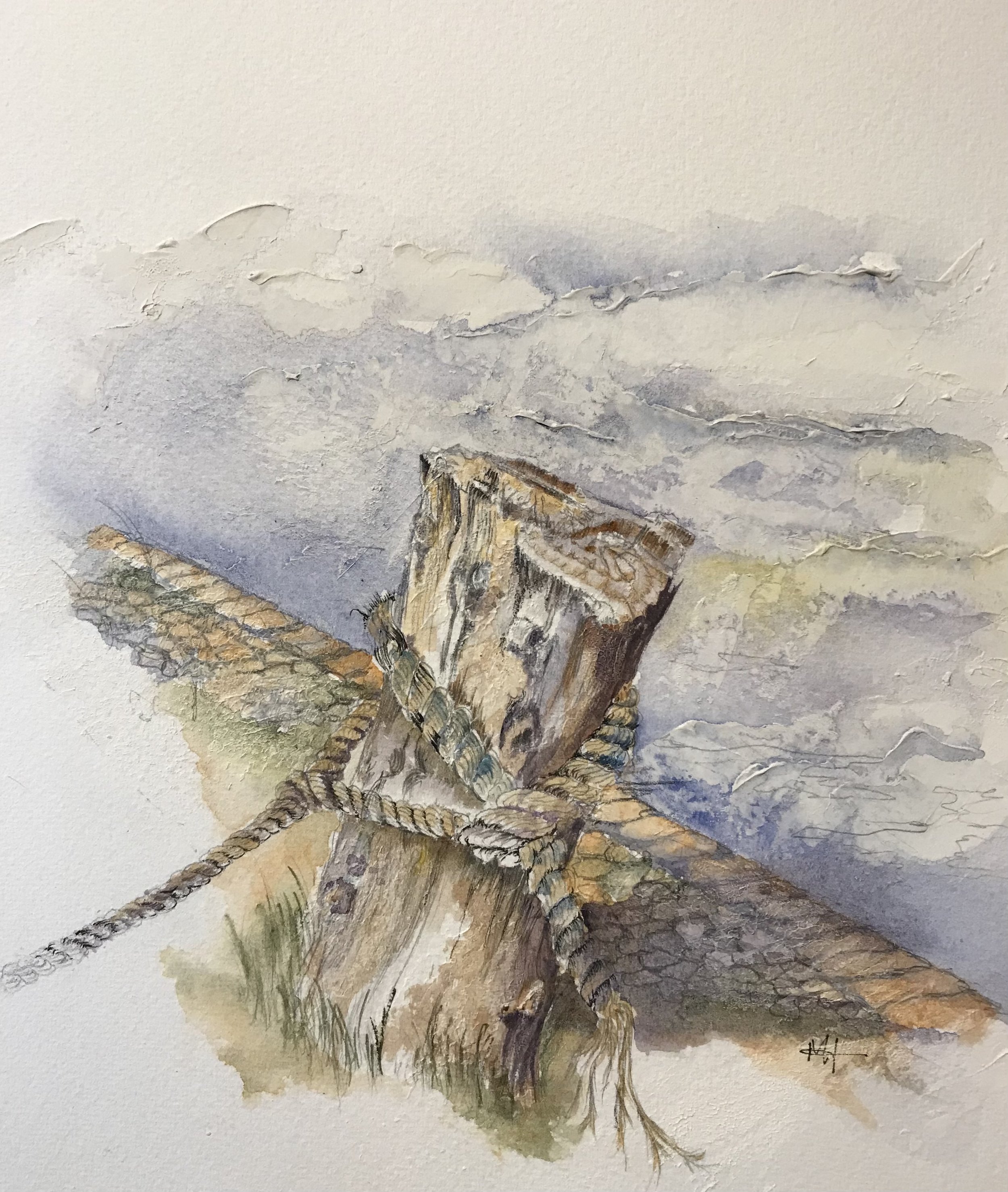 An old weathered towpath mooring post.