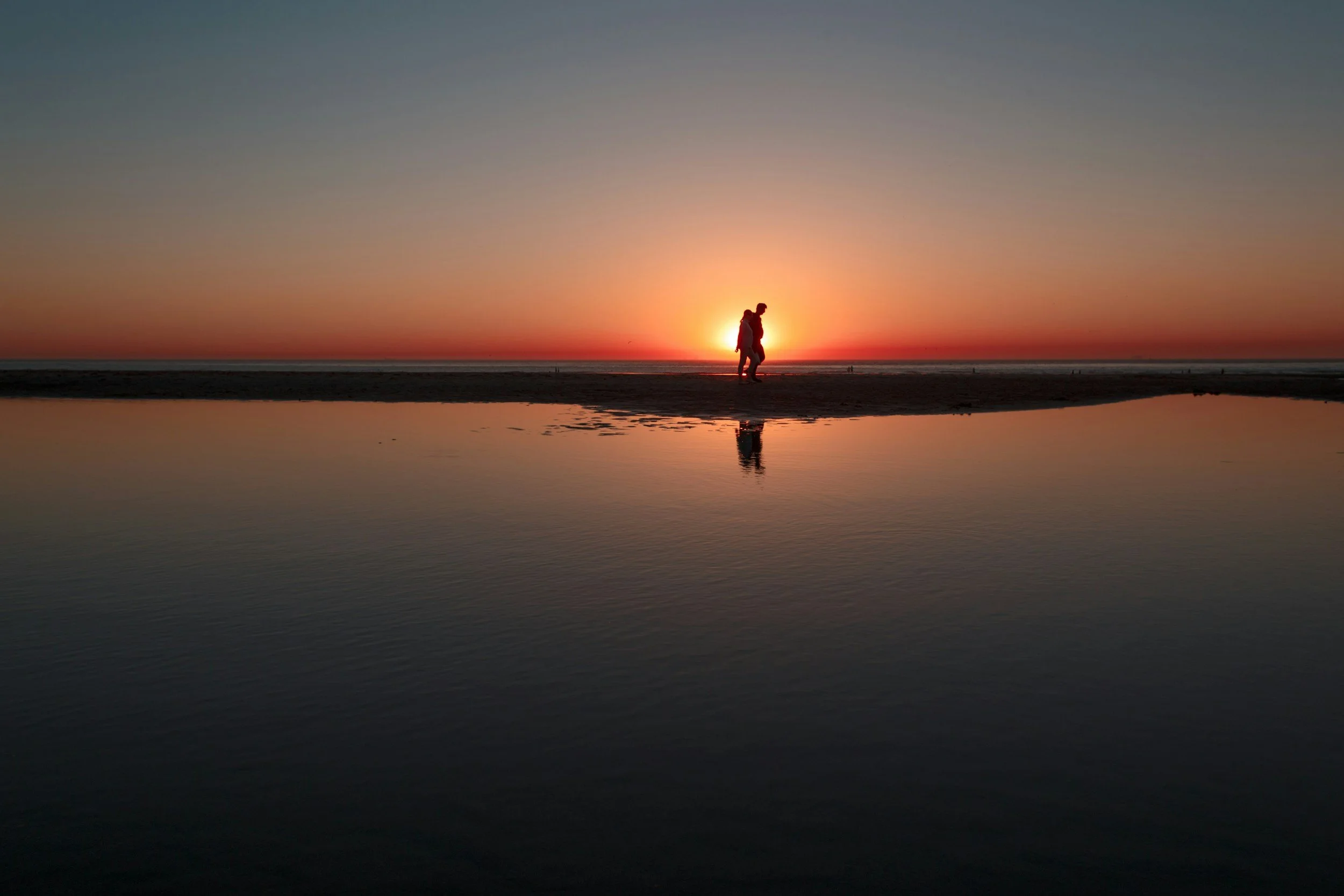 Walking beach at sunset 
