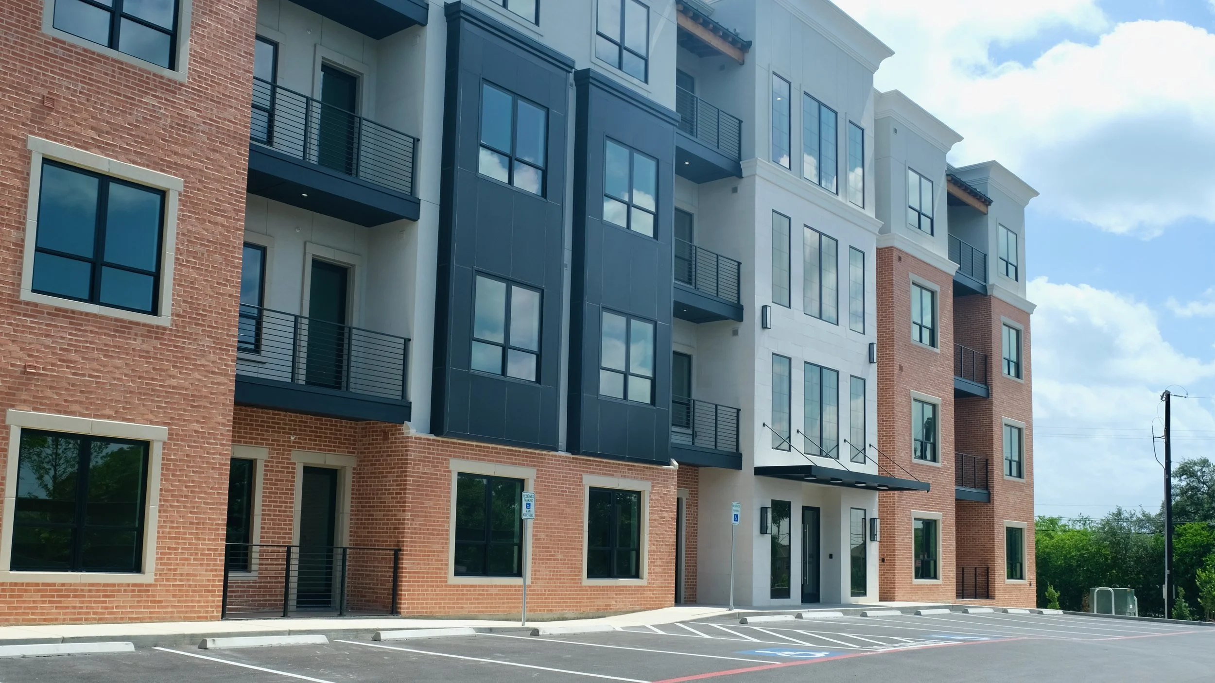 Multifamily Apartment Building Aluminum Composite Material Panels and Honed Limestone Tile