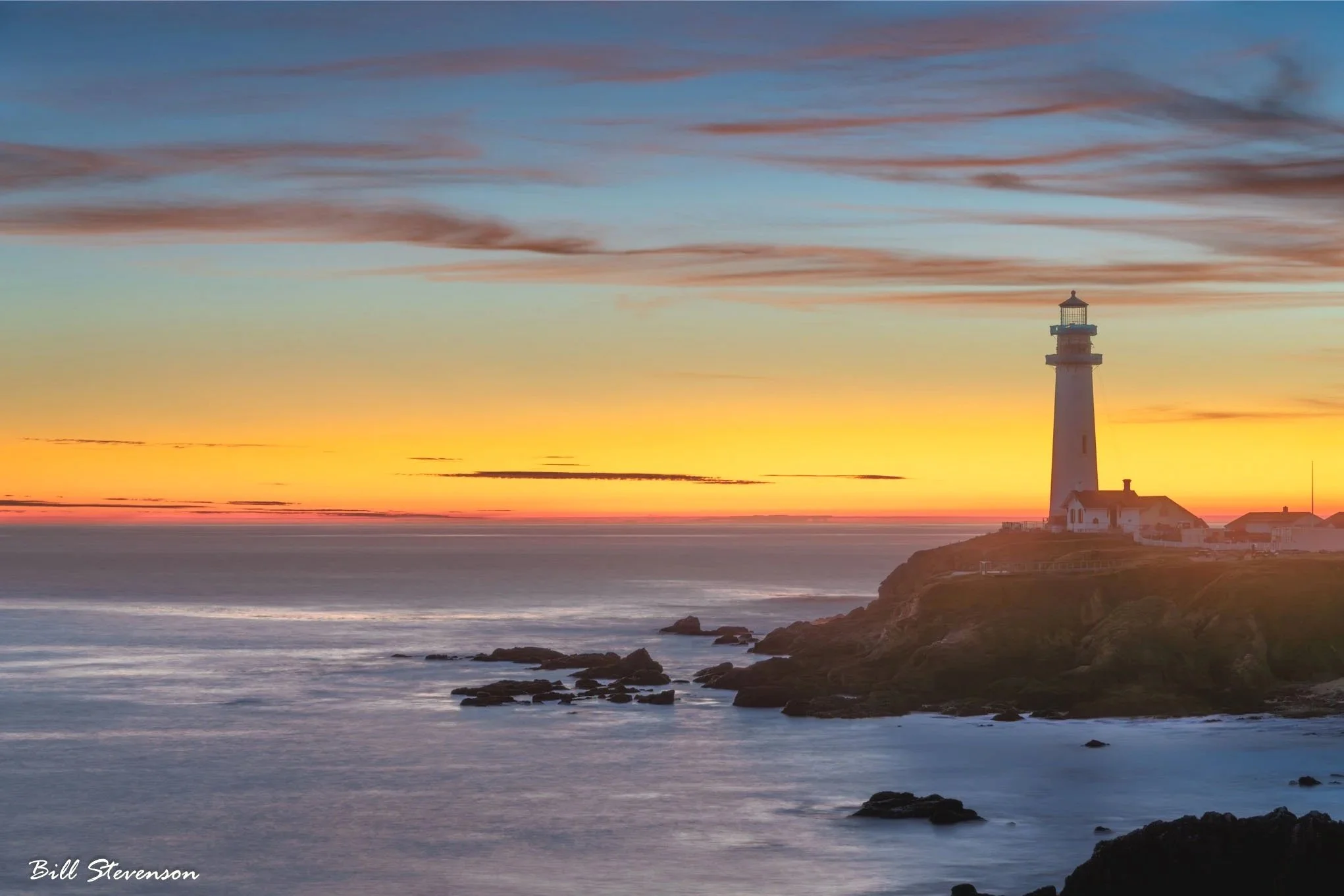 Sunset and Pidgeon Point Lighthouse on the California coast.