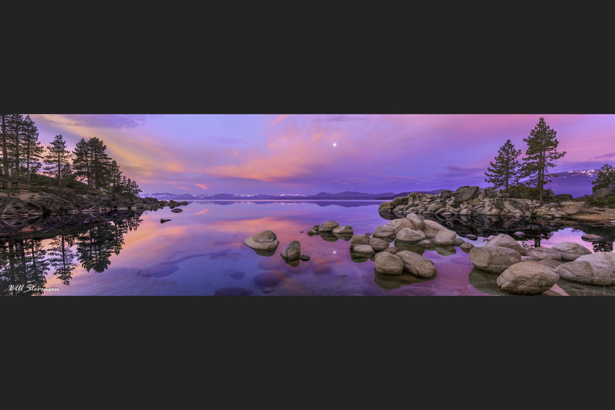 A sunset and a setting moon over Sand Harbor, Lake Tahoe