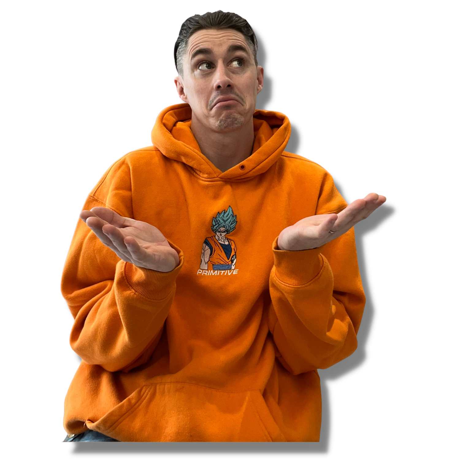 A man wearing an orange hoodie with a Dragon Ball Z character print and 'Primitive' text, shrugging with a confused expression against a black background.