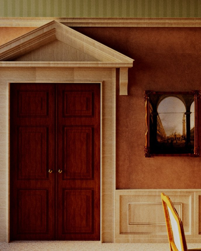 Una porta di legno con cornice decorativa in una stanza elegante, con pareti colorate e un quadro alle spalle.
