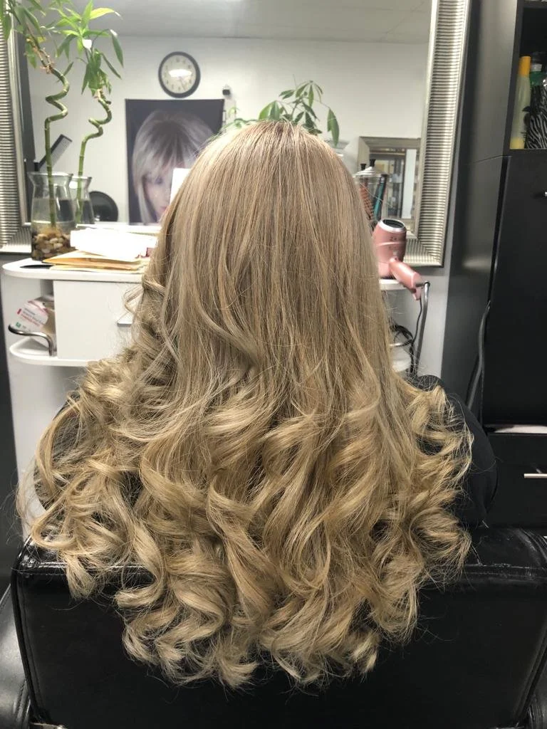 Our conditioning treatment really helped this client's hair shine!