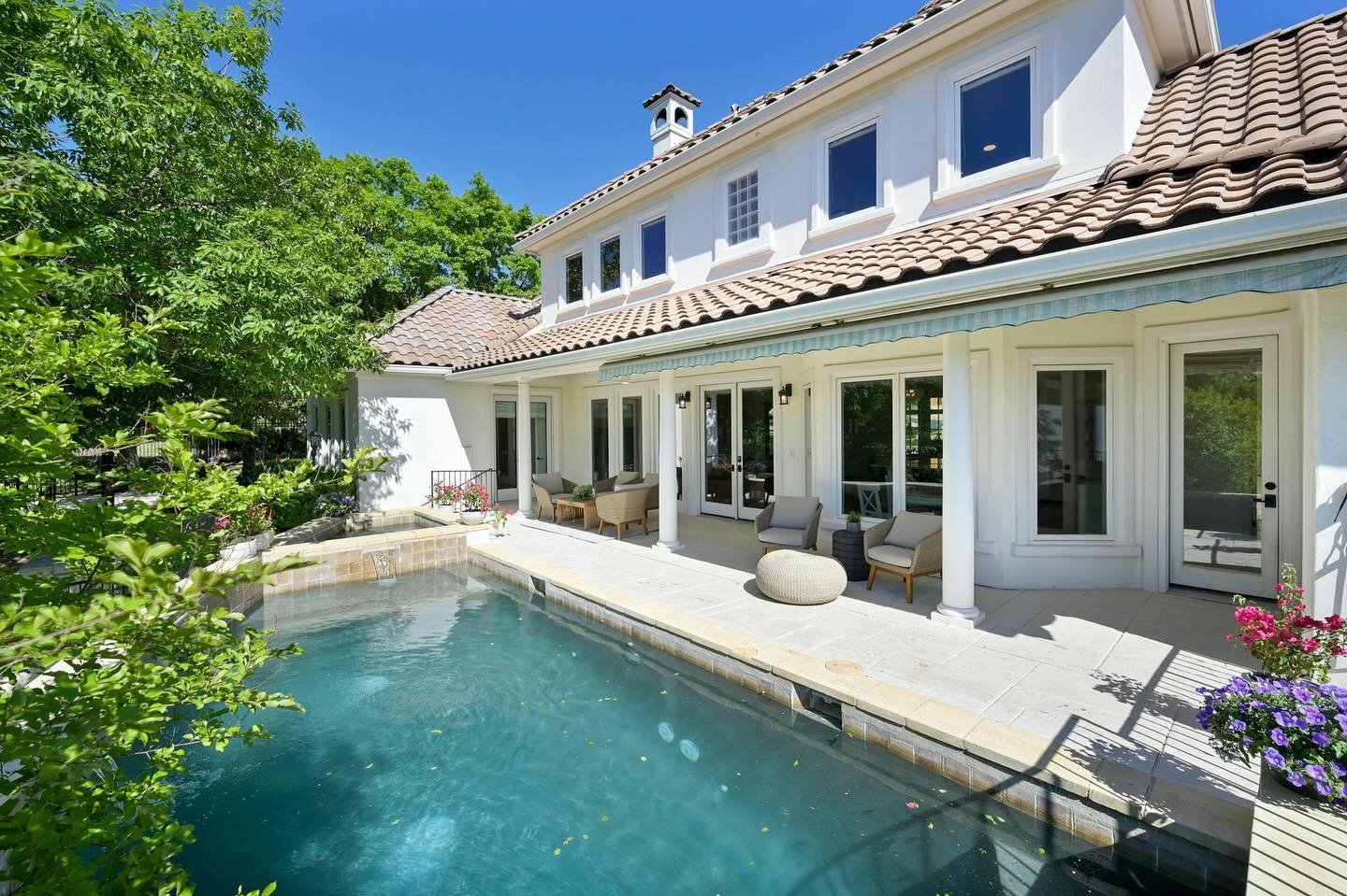 Welcome to an exceptional residence nestled within Barton Creek&rsquo;s gated enclave, Woods Three, offering a serene retreat. The main living areas seamlessly flow onto a veranda overlooking the sparkling pool and lush landscaping, creating a perfec