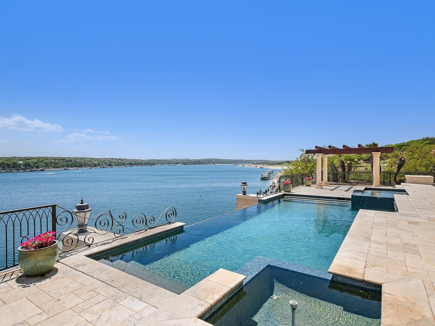 Nestled within a privately gated community in Lago Vista lies an extraordinary estate spanning over 9 acres across three pristine waterfront lots in the esteemed enclave of Waterford on Lake Travis. Immerse yourself in sweeping 180-degree vistas that